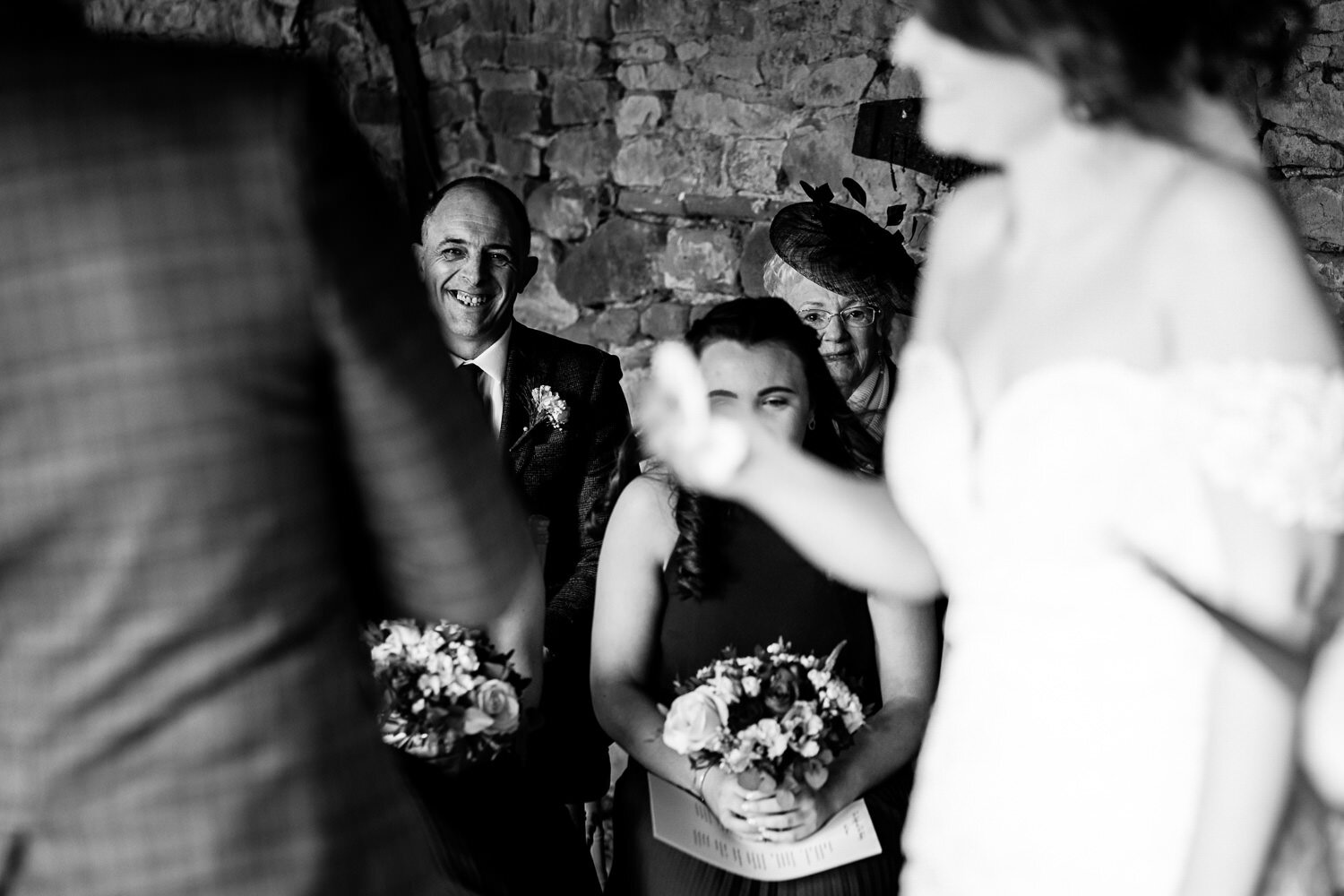 Laughing wedding guests at Lyde Court