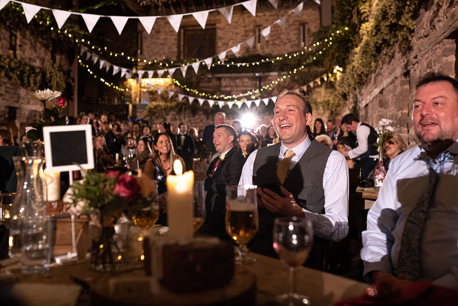 Guests laughing at Lyde Court wedding