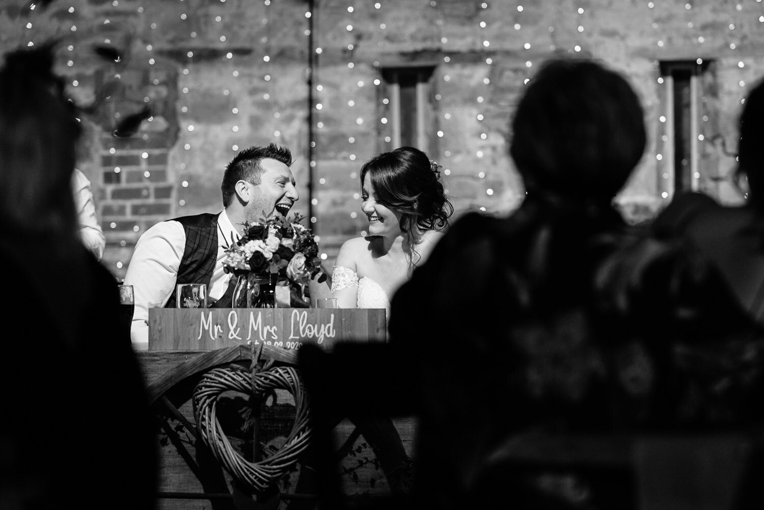 Laughing groom during wedding at Lyde Court