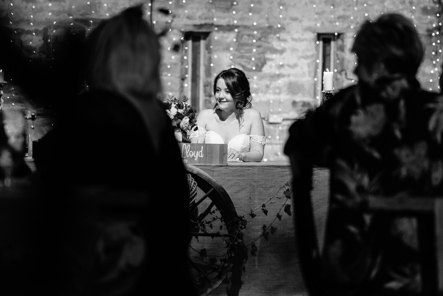 Bride laughing at Lyde Court wedding speeches