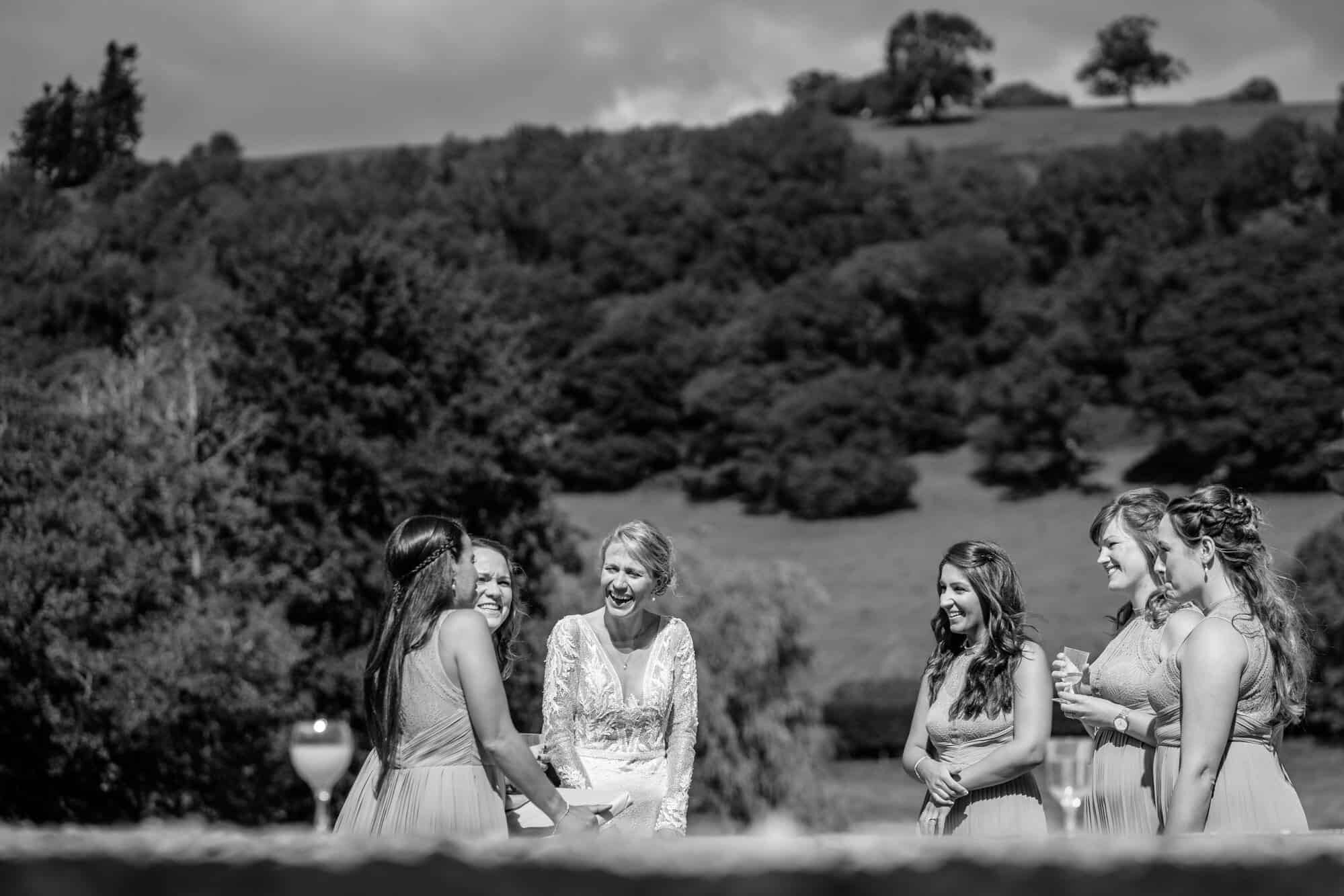 Laughter from bride and her bridesmaids at micro wedding
