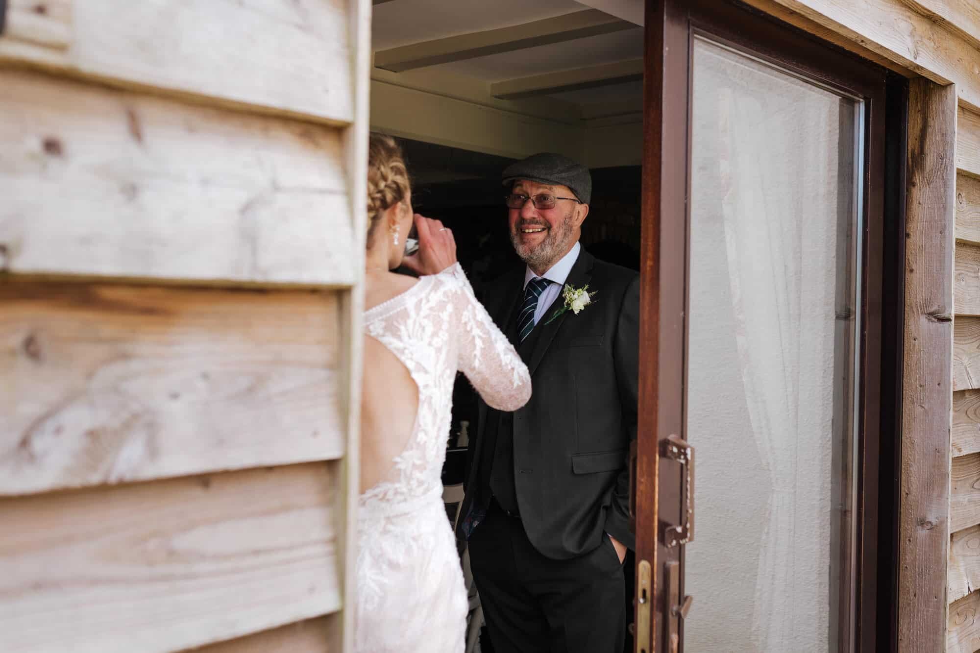 Father of bride laughing 