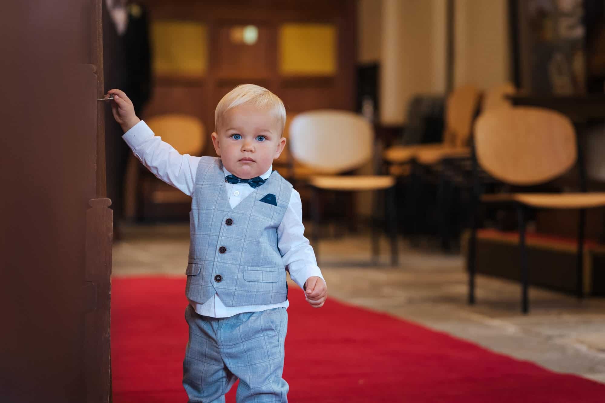 Little boy in church at Wales wedding