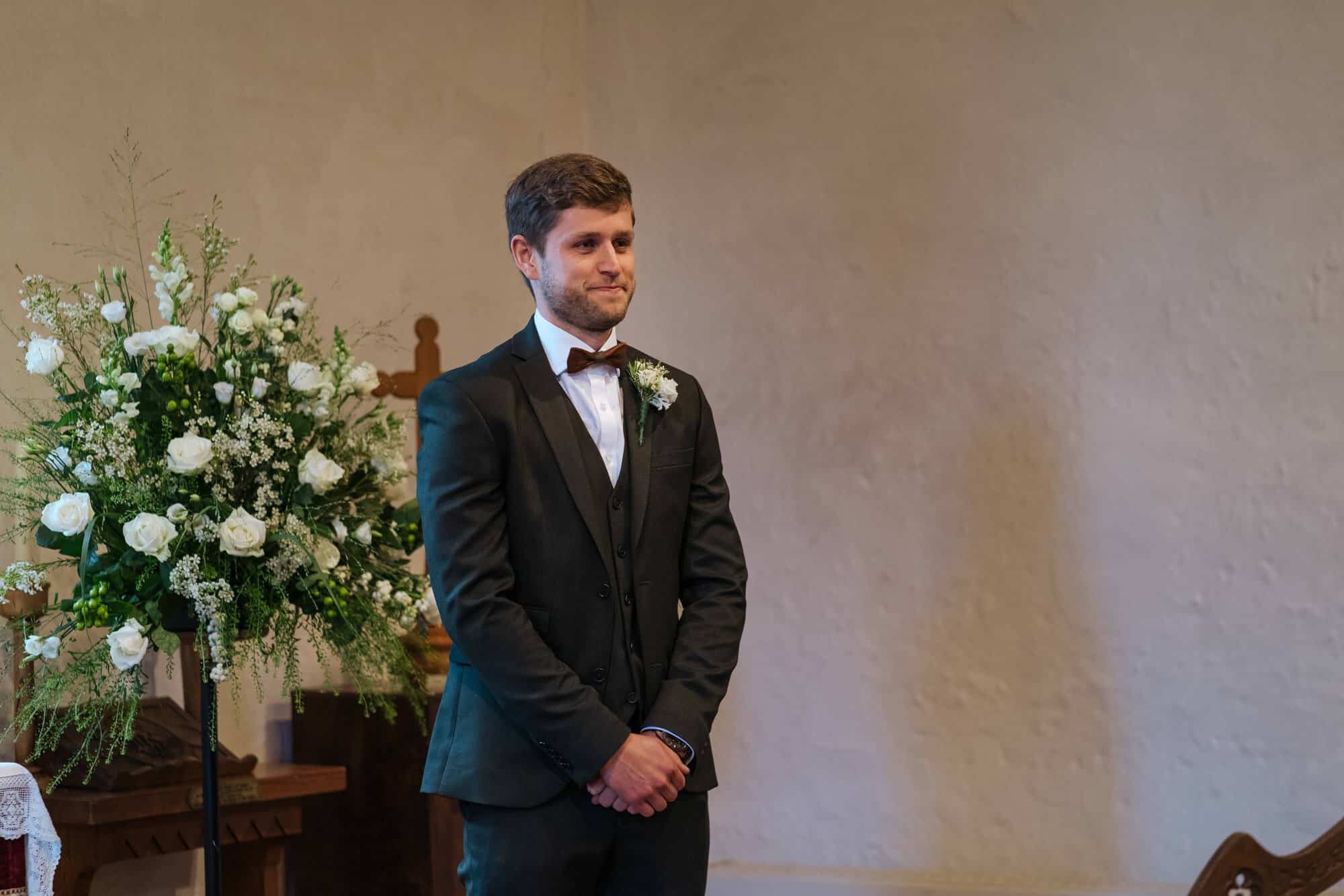 Groom waiting for his bride at church