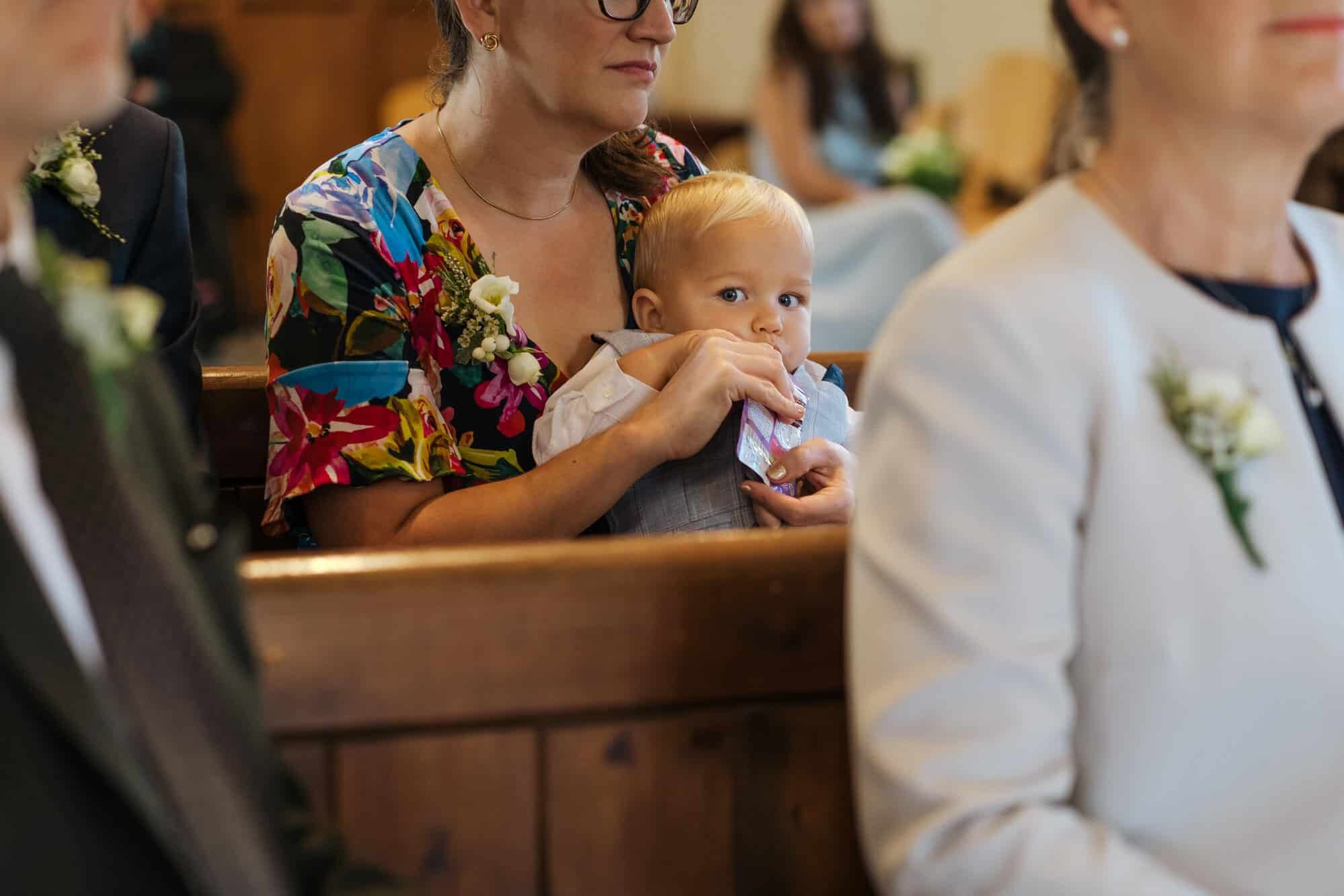 Cute baby during church wedding