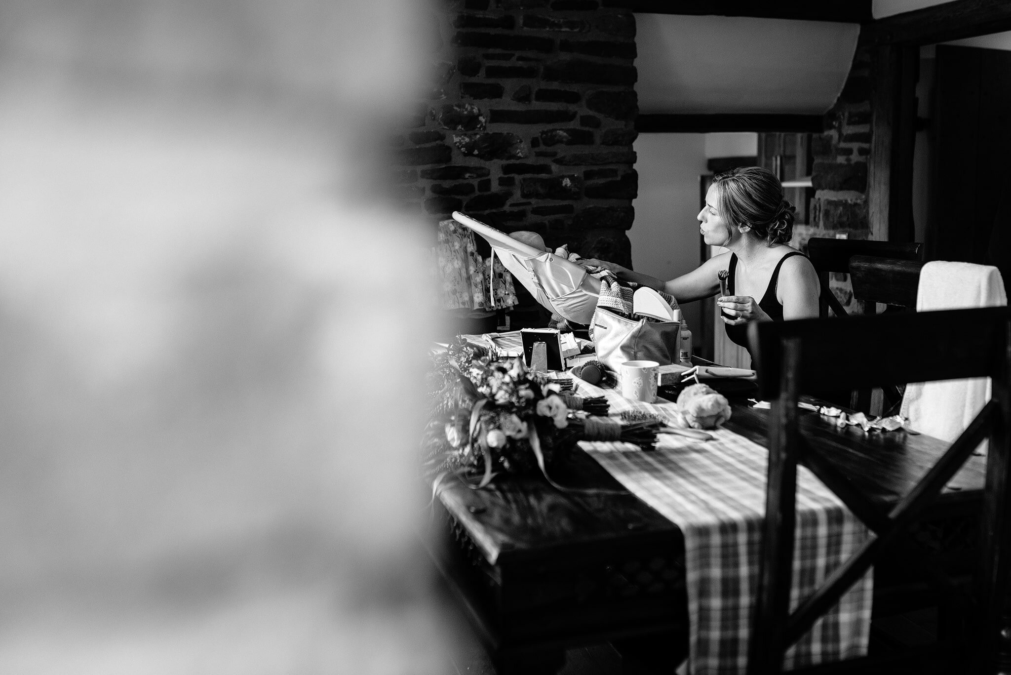 Bride feeding baby at wedding