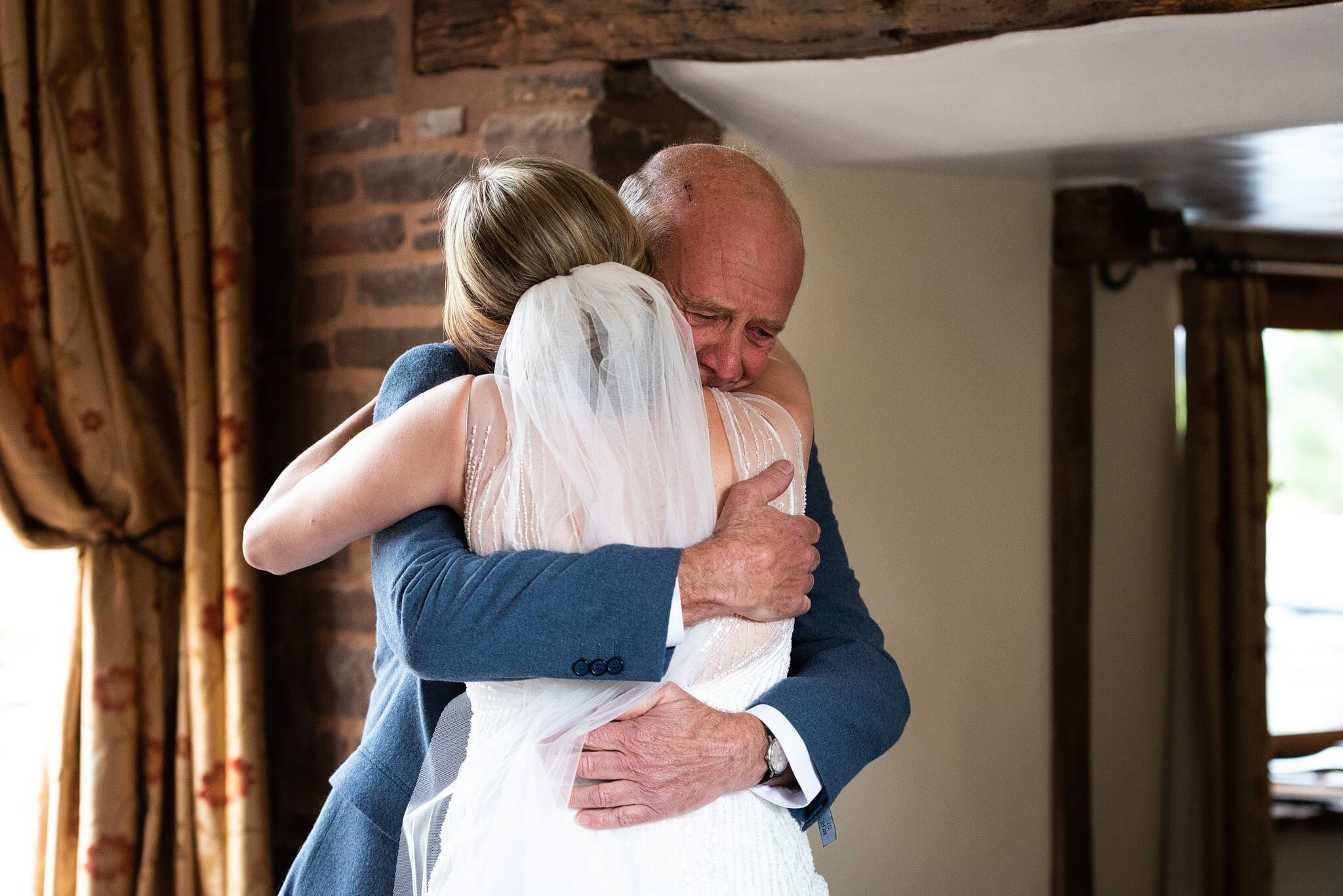 Father and bride crying at Sugar Loaf Barn