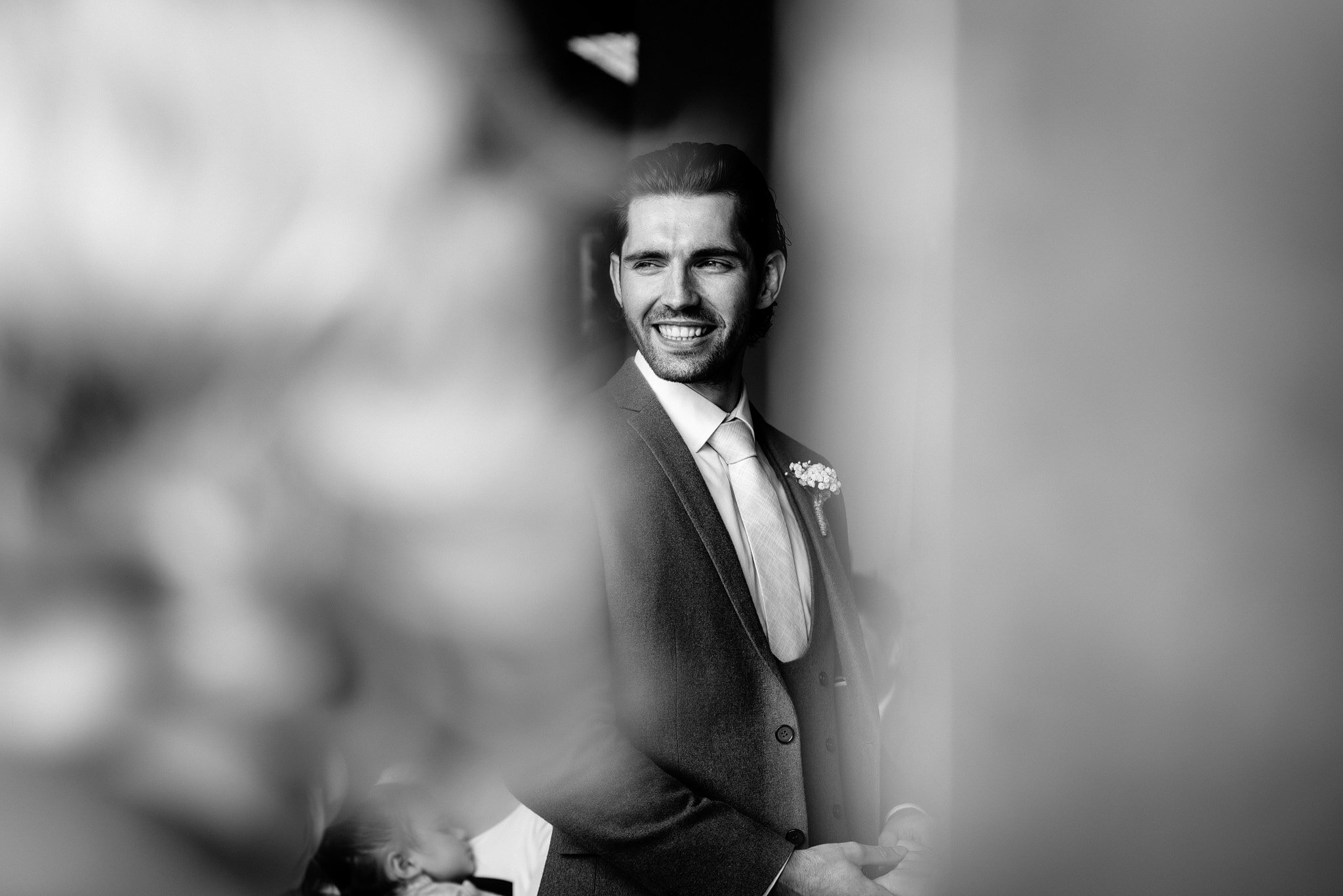 Smiling groom at wedding