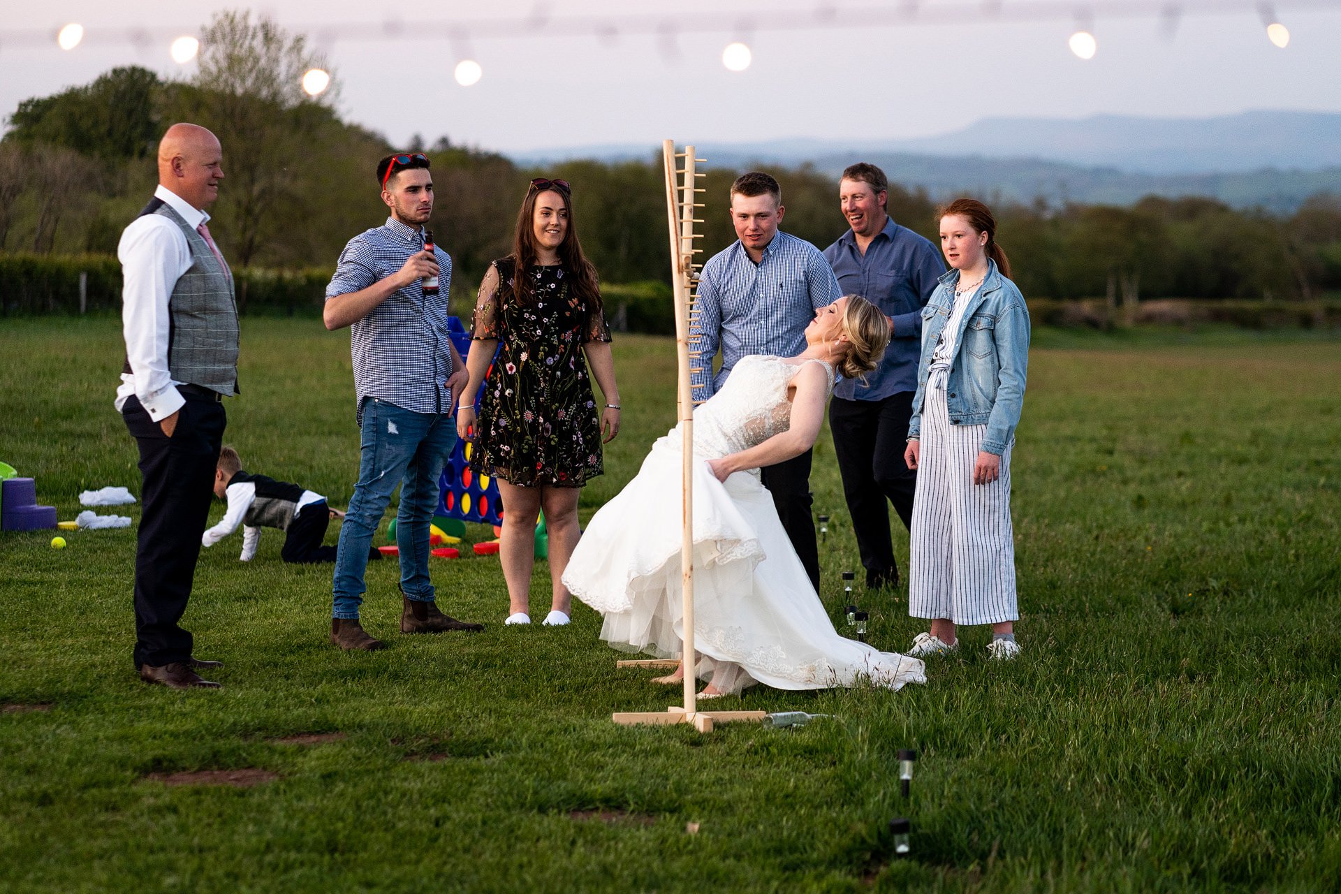 Brecon wedding guests playing limbo