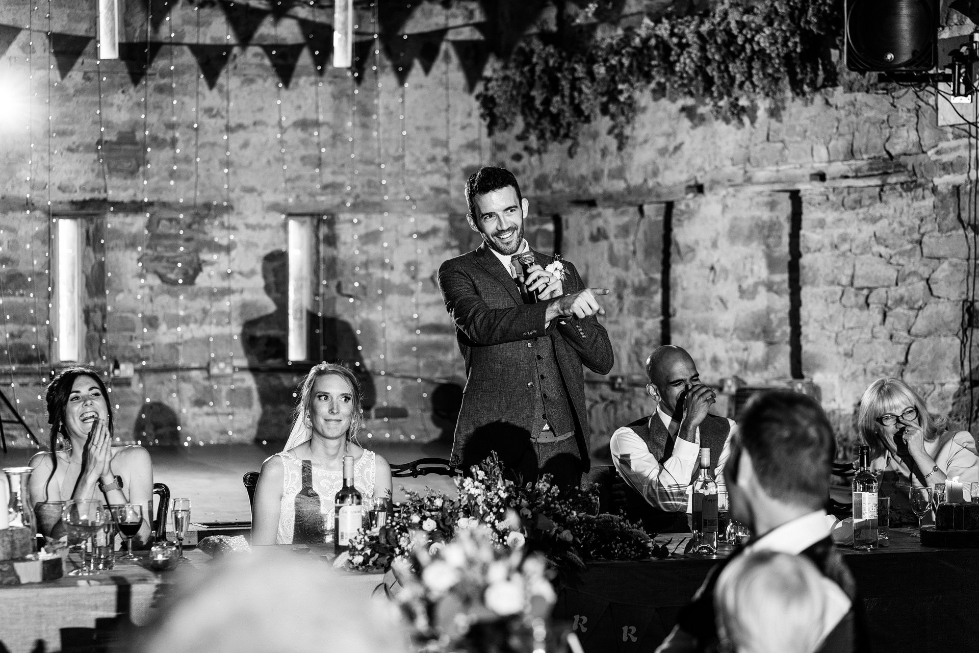 Bride making funny face during Groom speech at Lyde Court