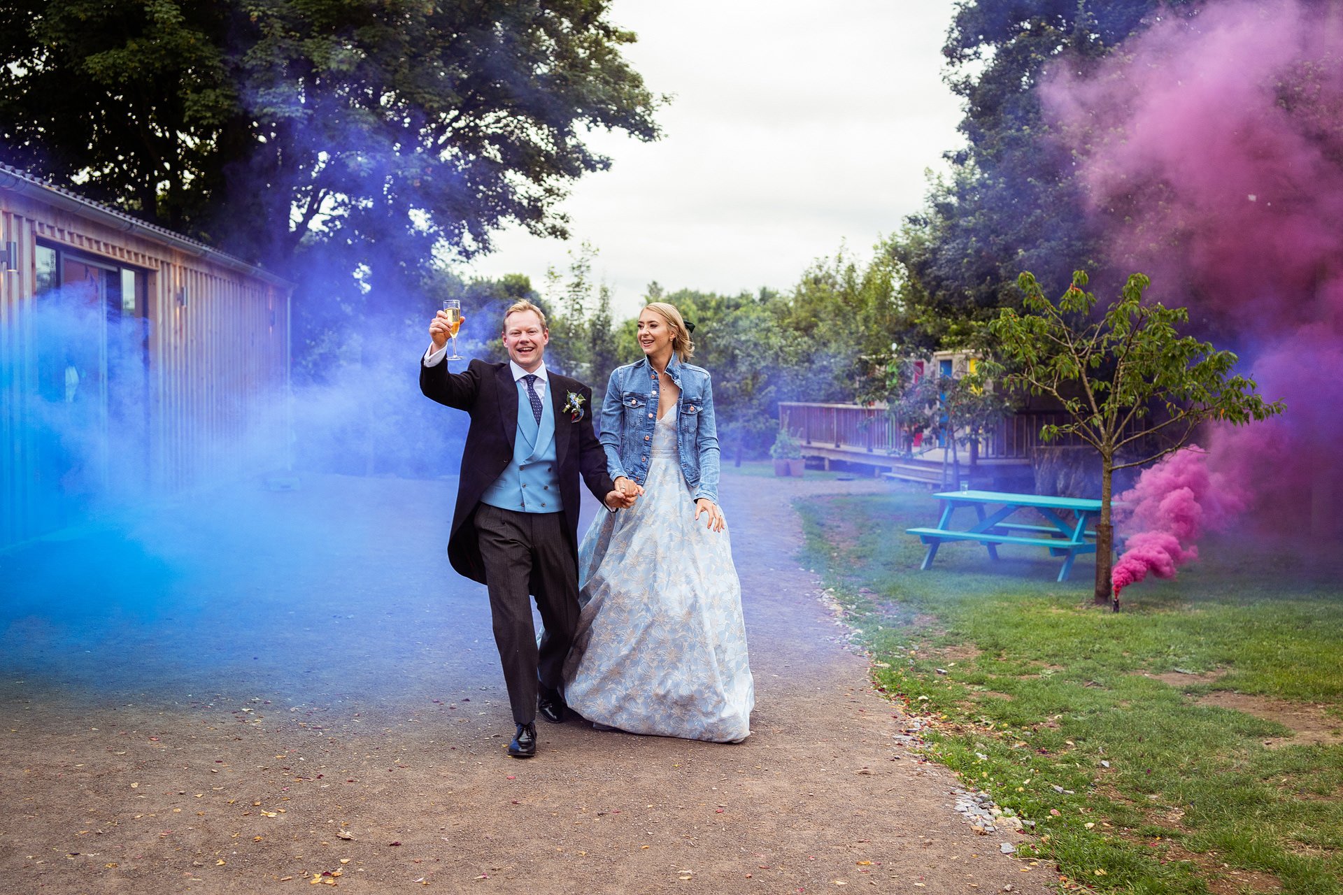 Smoke bombs bride and groom entrance at The Holford Arms
