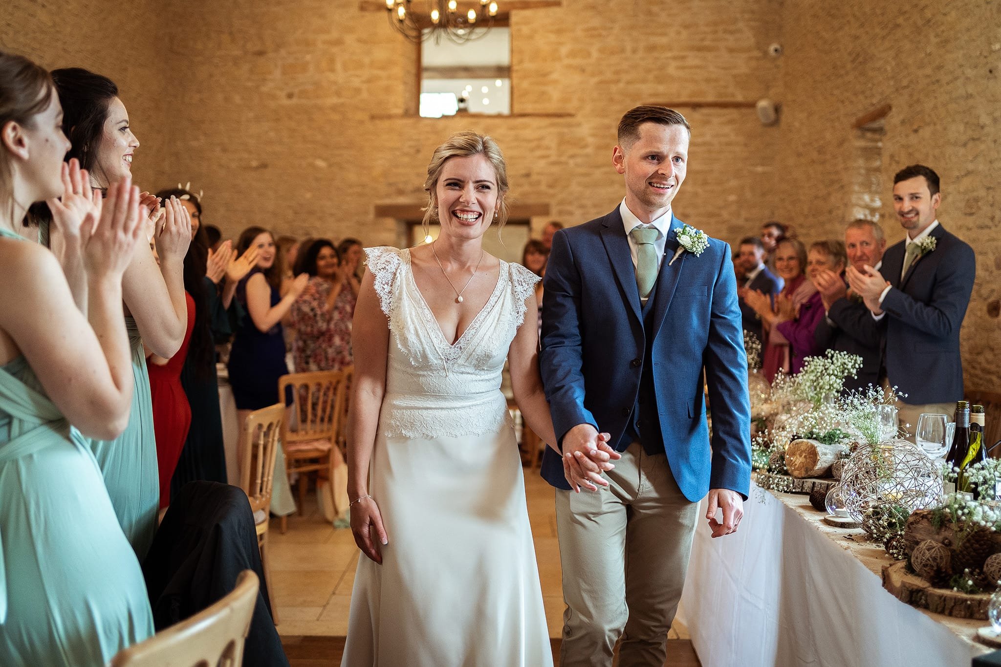 Kingscote Barn bride and groom entrance to wedding breakfast