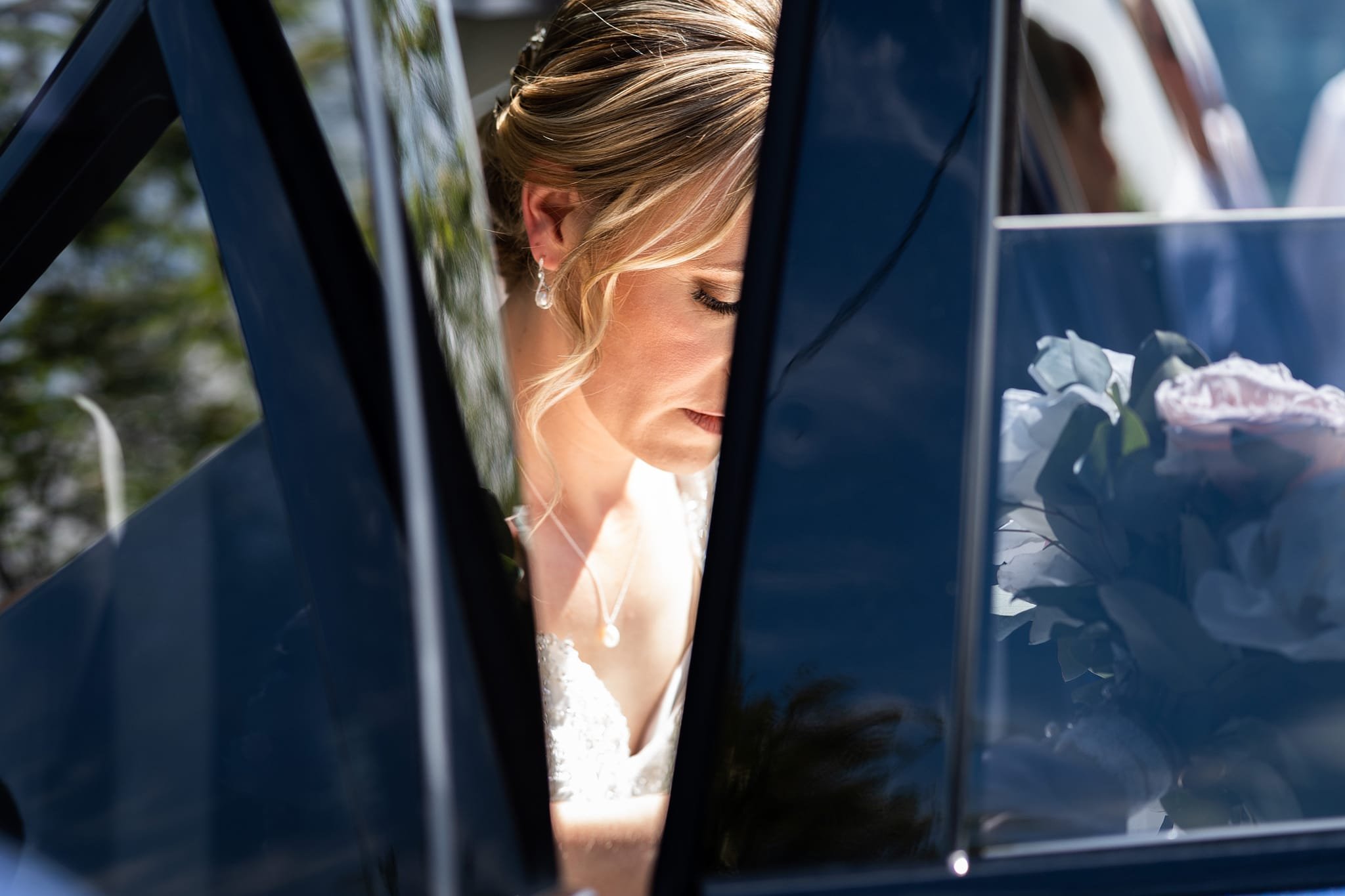 Bride's face getting gout of car