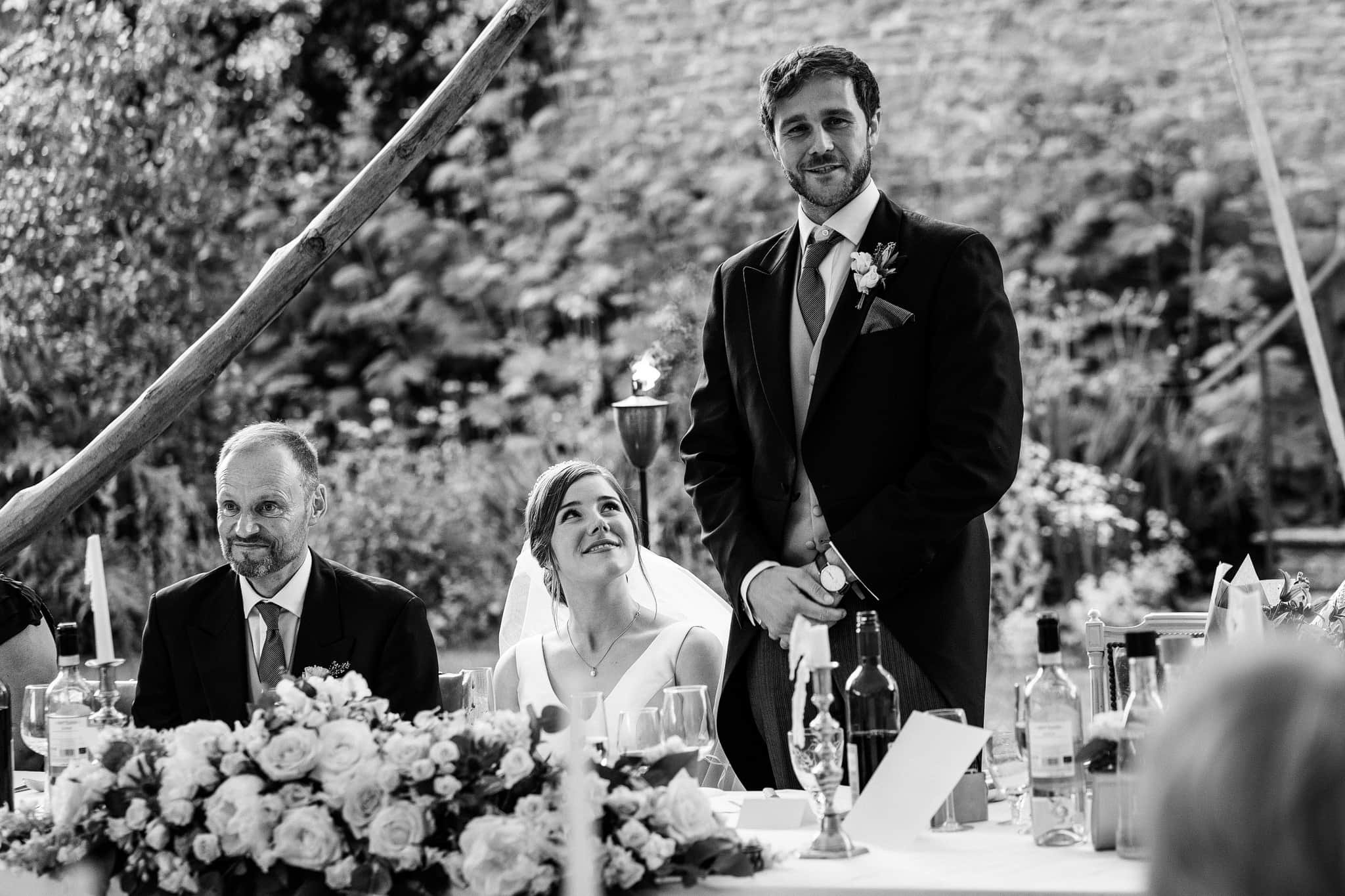 Bride looking at Groom during wedding speeches