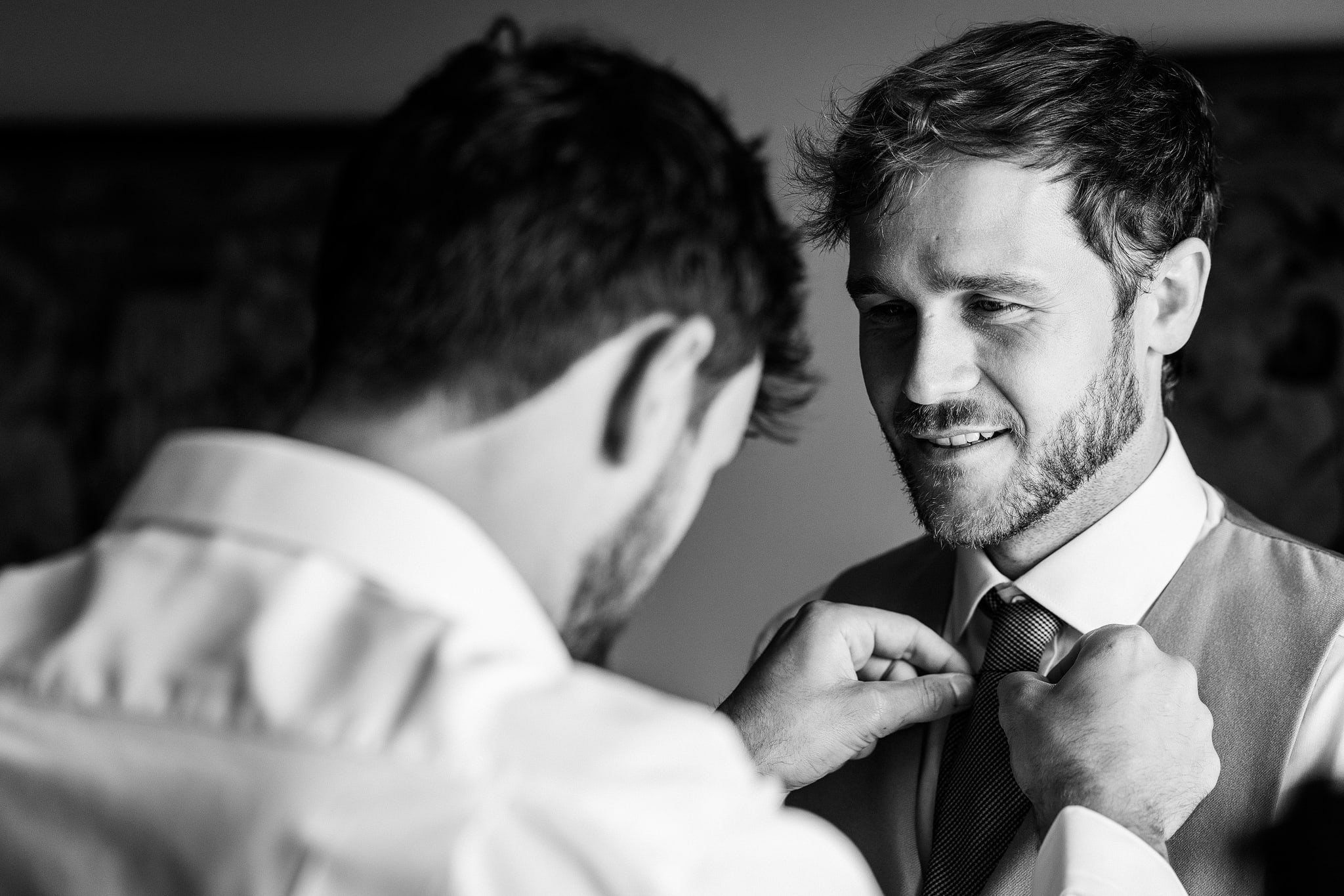 Best man dressing groom