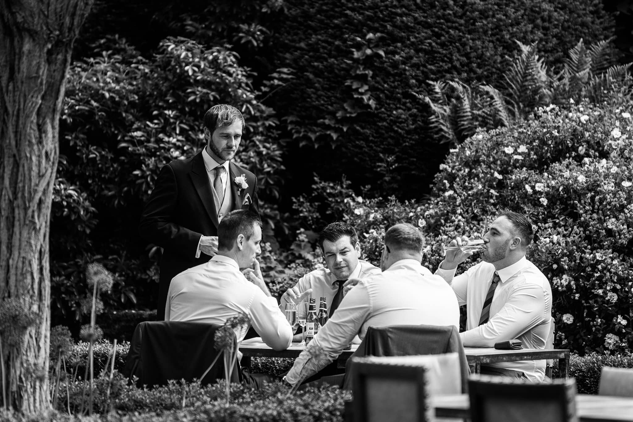 Groom and friends having a drink