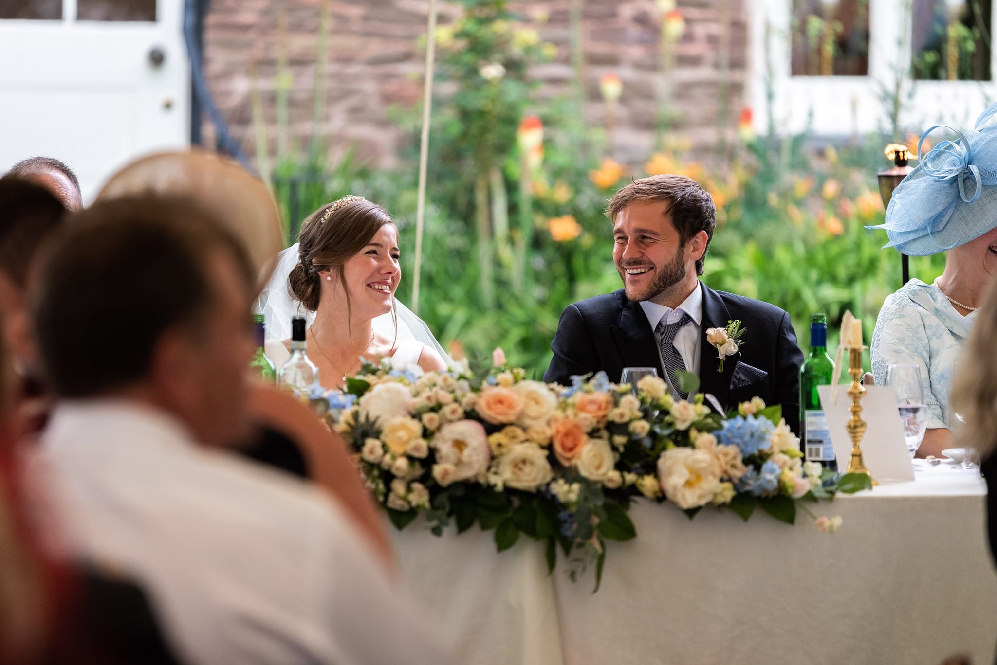 Wedding speeches groom smiling at bride