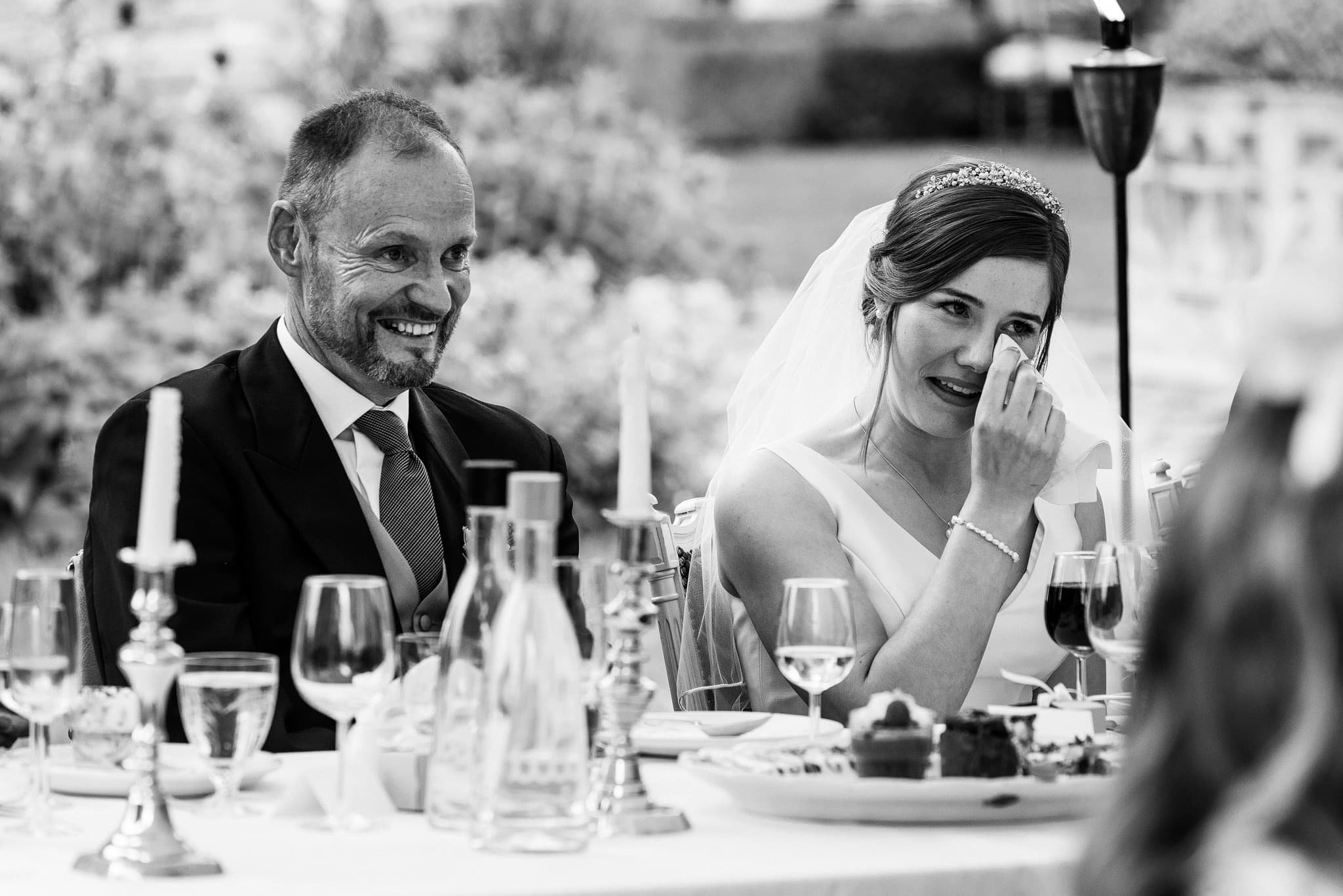 Bride crying during speeches at Dewsall Court wedding