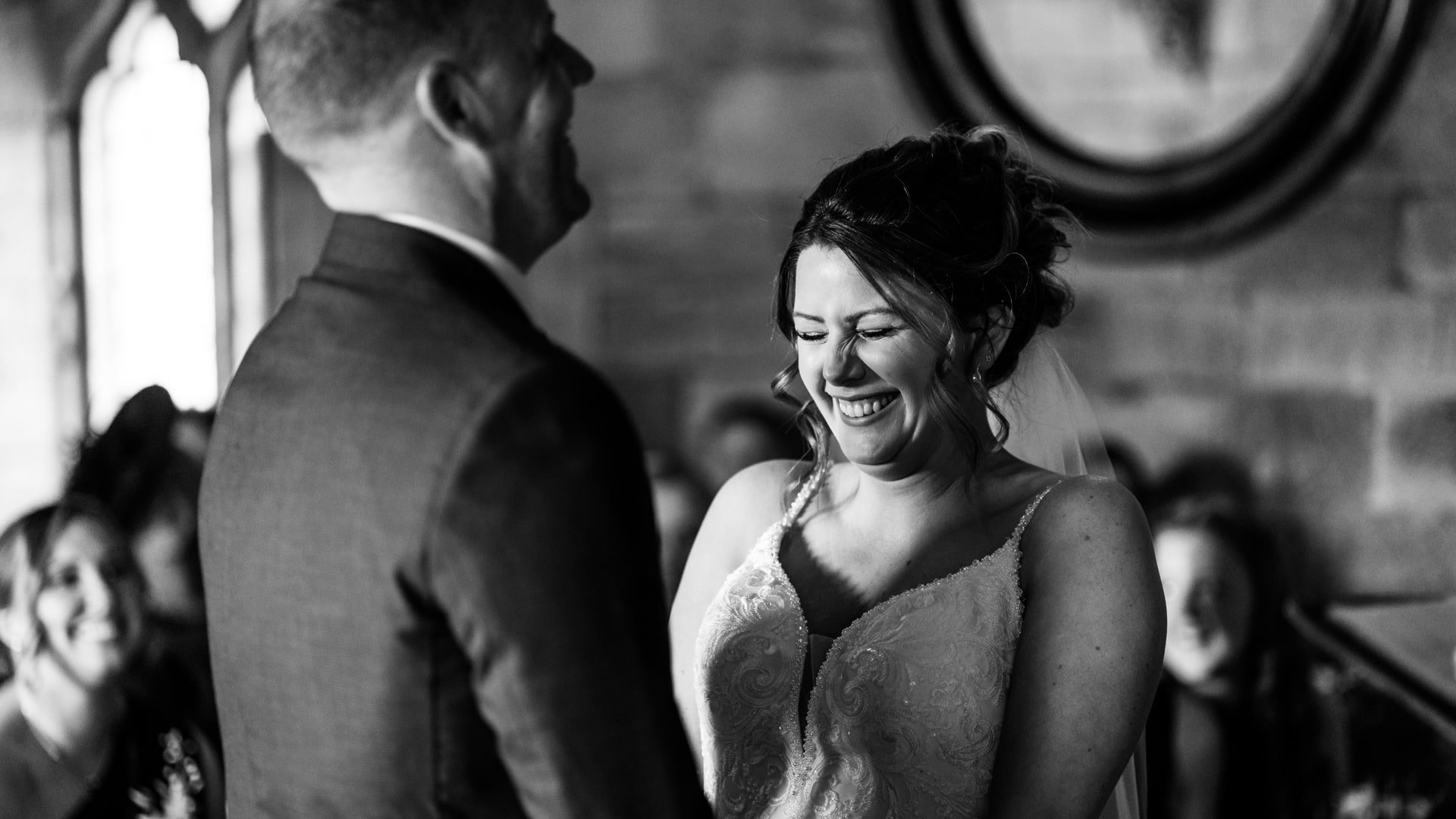 Bride laughing during Brinsop Court wedding ceremony