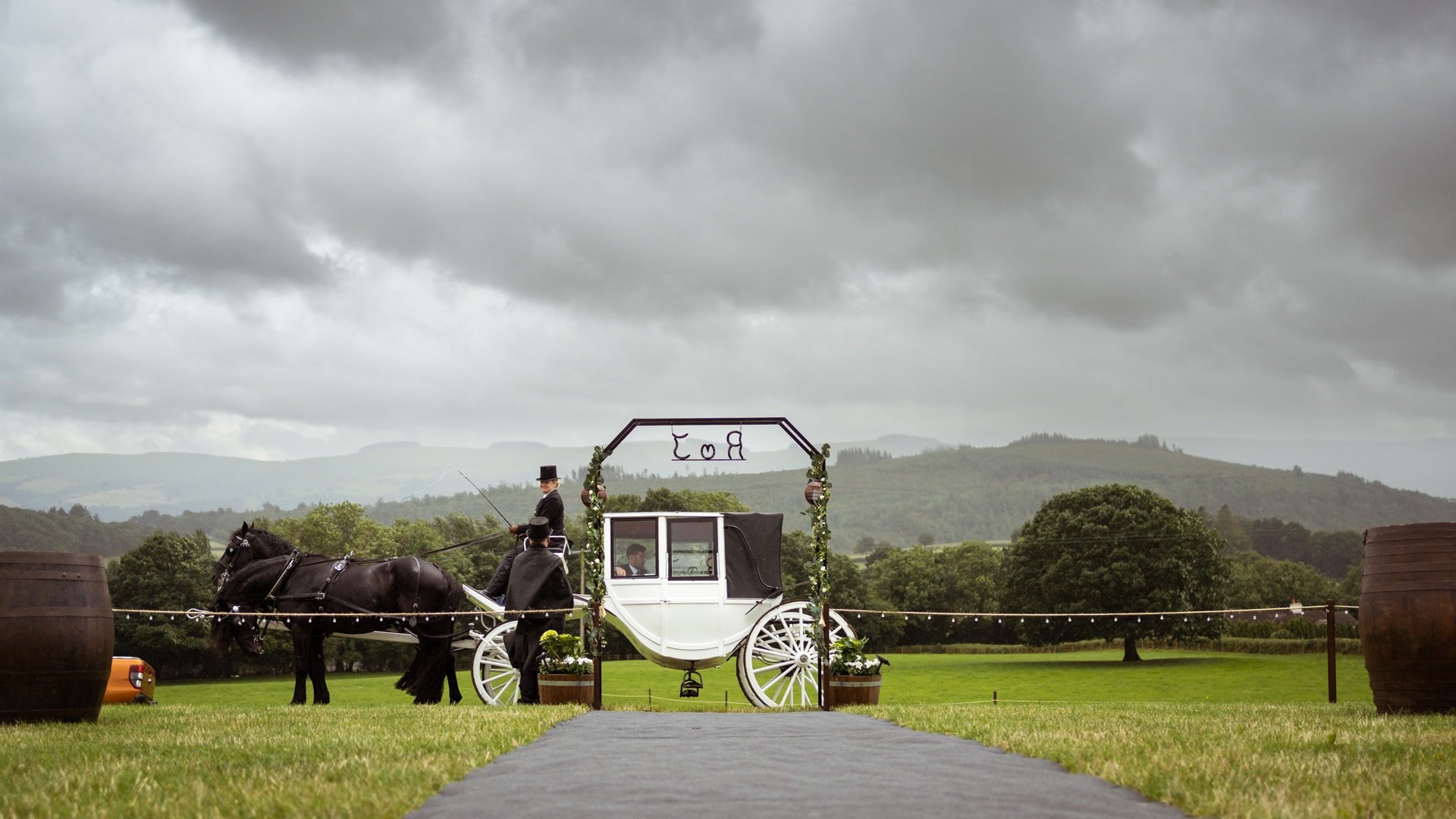 Horse and carriage during stormy wedding