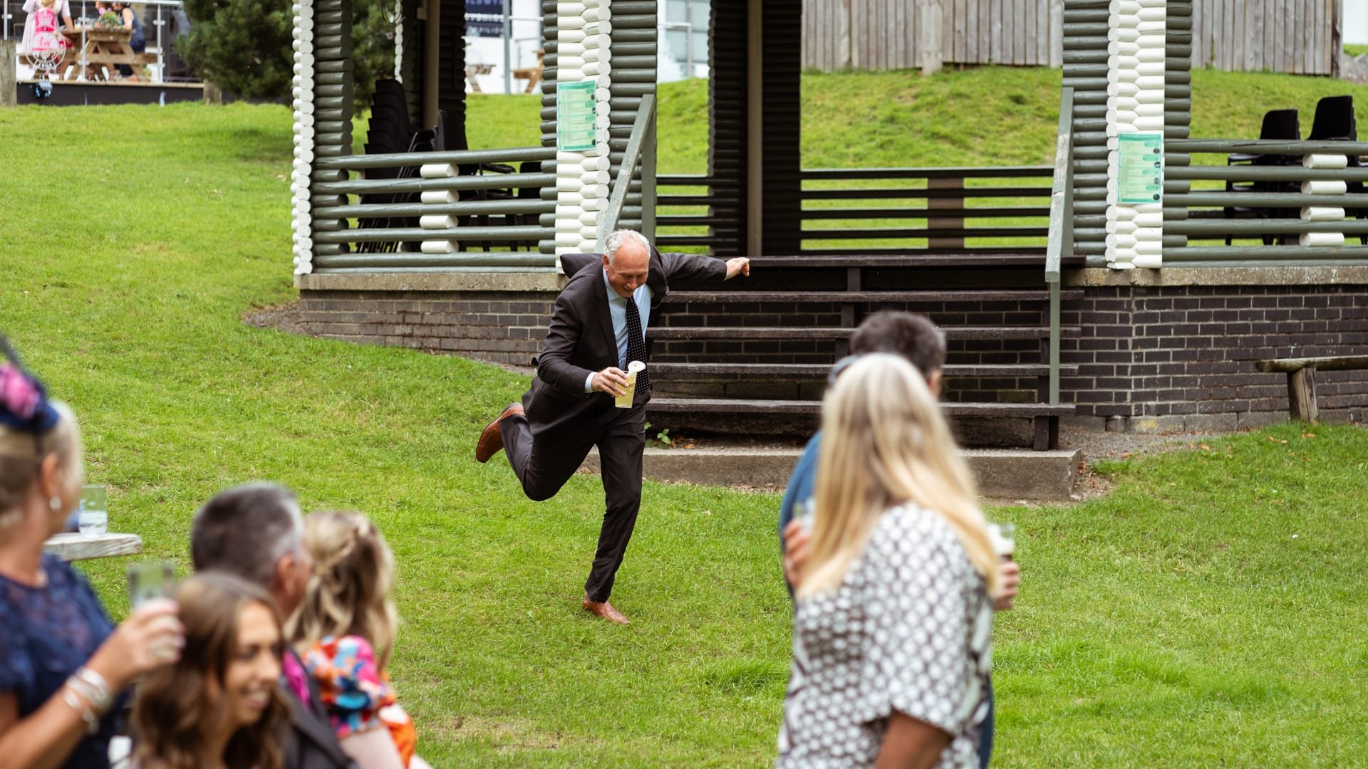 Wedding guest running and nearly falling over