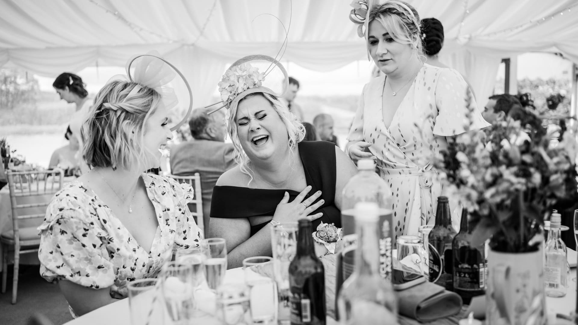 Wedding guests laughing at Brecon wedding
