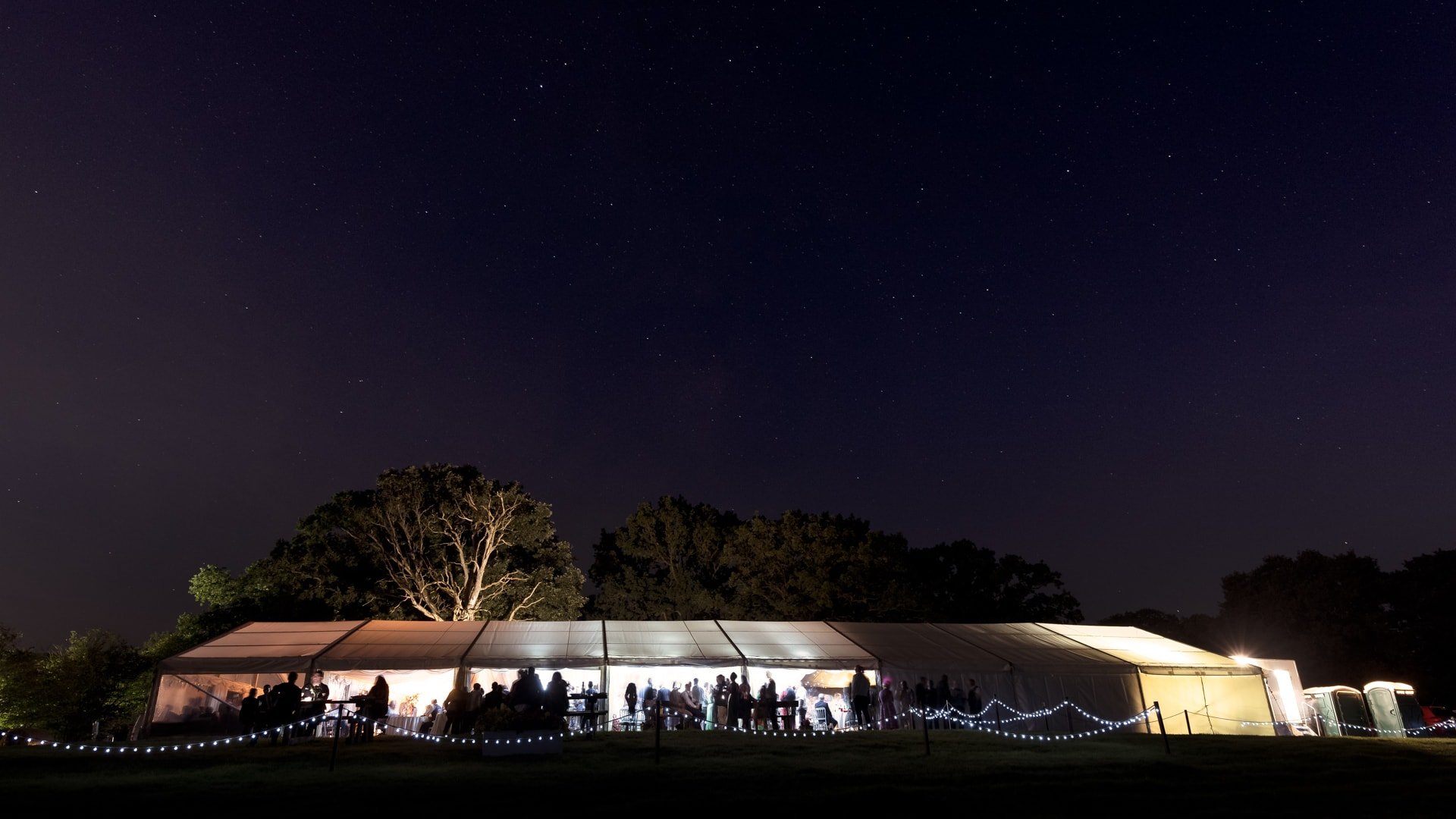 Night photograph of a wedding marquee