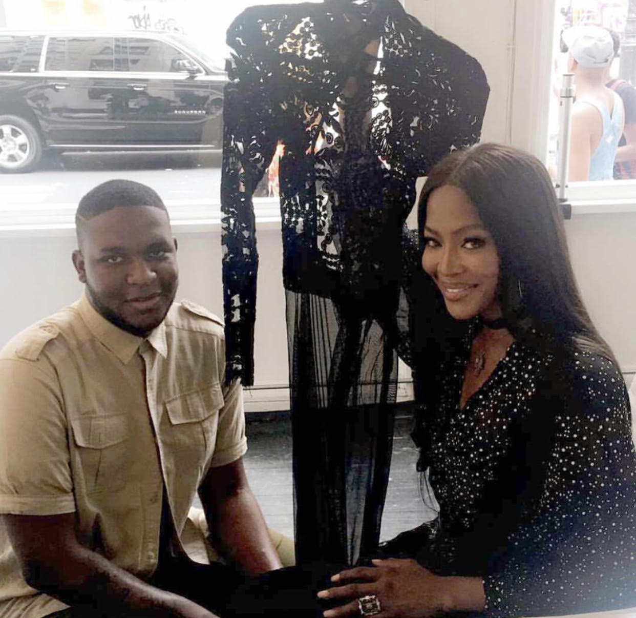 Zwade Devenish presenting one of his gowns to supermodel Naomi Campbell (photo courtesy of the designer)