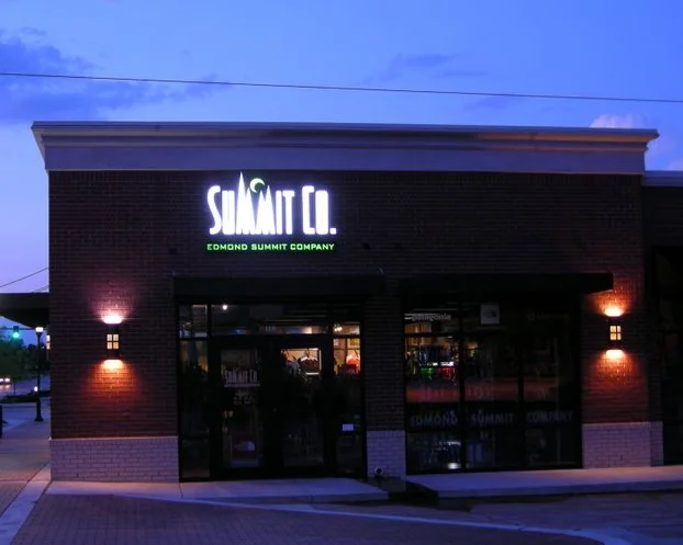 Edmond Summit Co's store on a winter night.