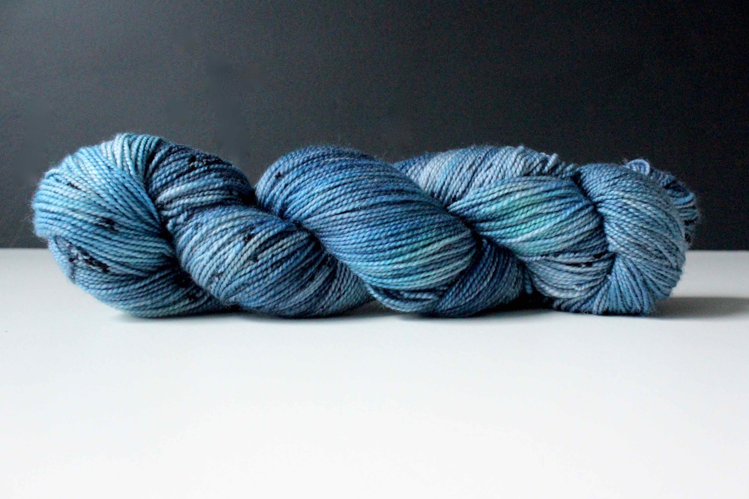 Folklore - Hand dyed sock yarn - grey and moss green speckled assigned