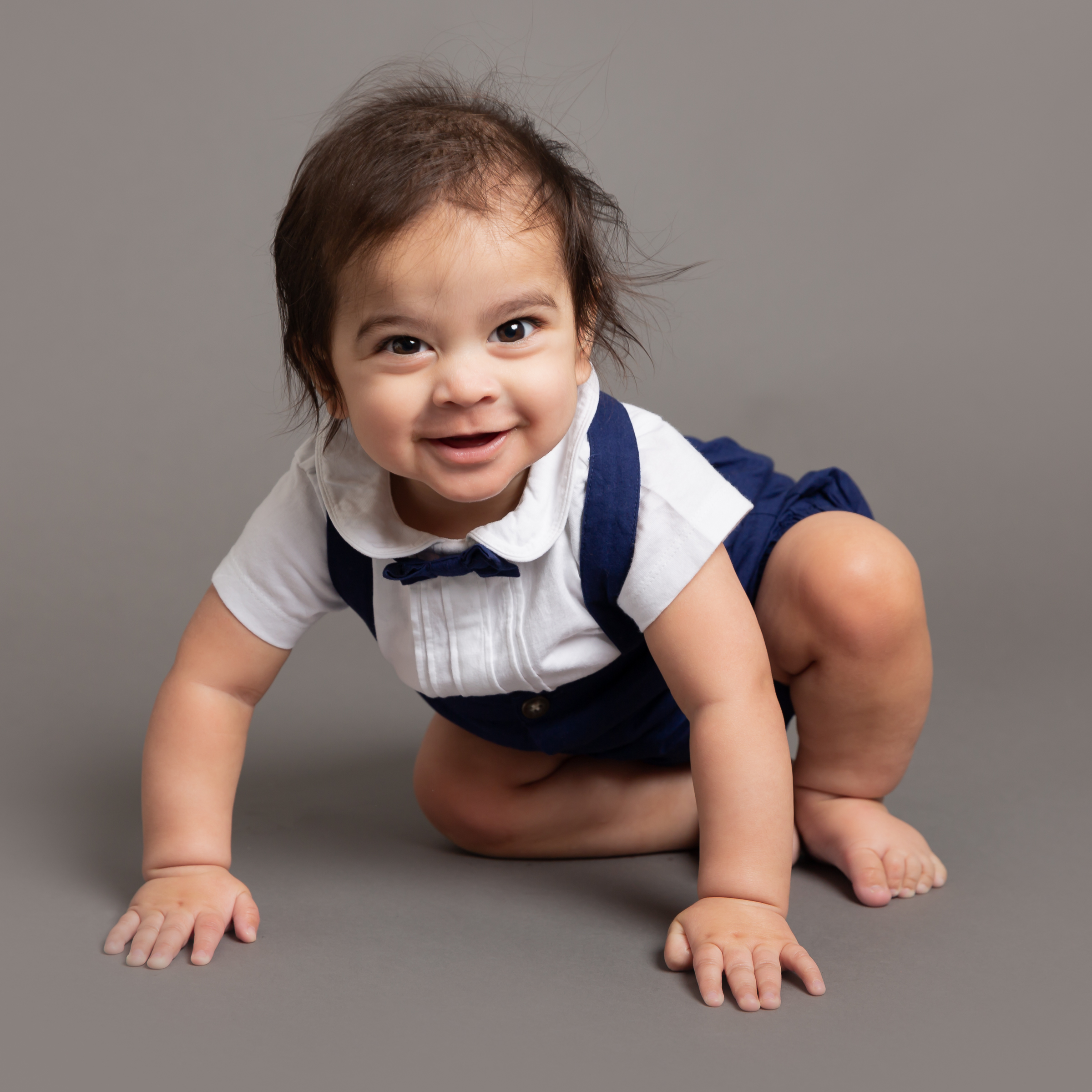 baby-boy-sitting-up-smiling-grey-studio-photo-london.jpg