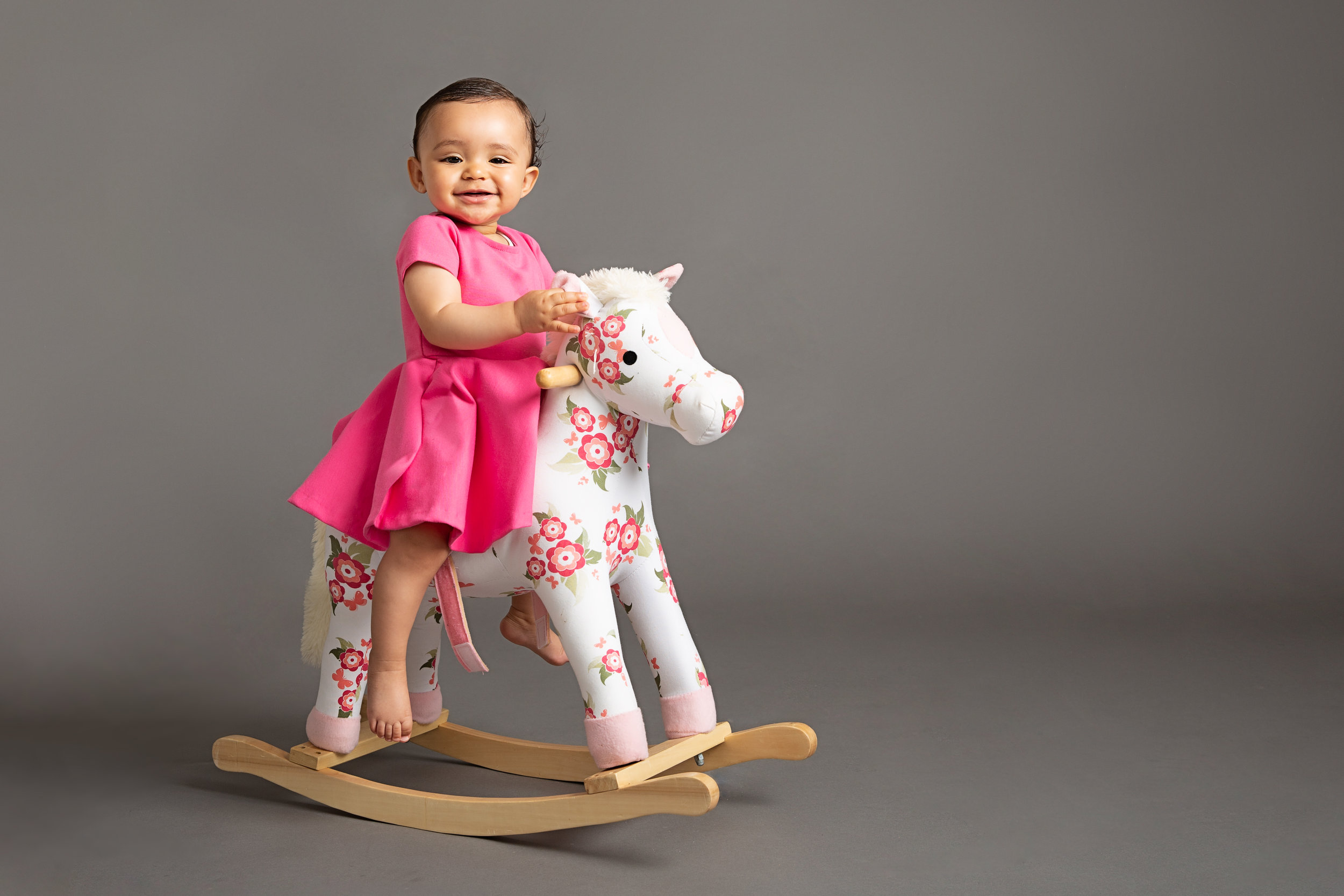 baby-girl-on-rockinghorse-photo-studio-london.jpg