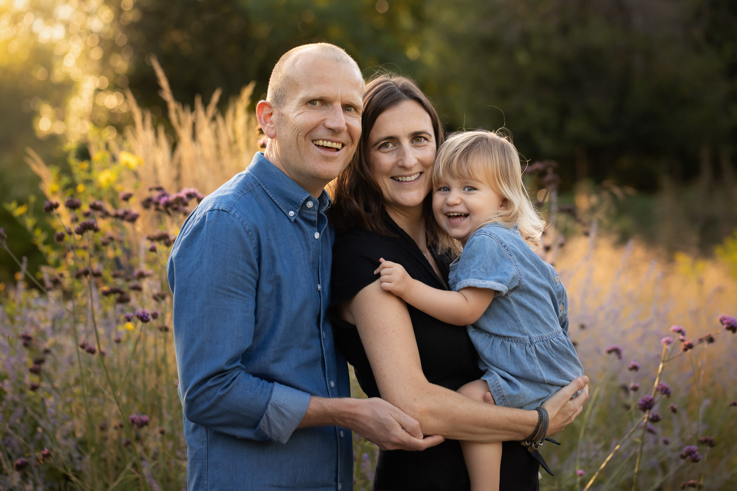 family portrait of parents and toddler