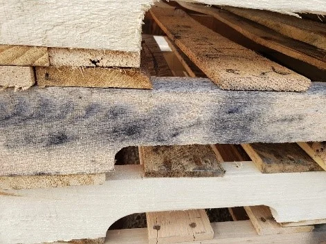 Close-up of iron stain discoloration on pallet lumber