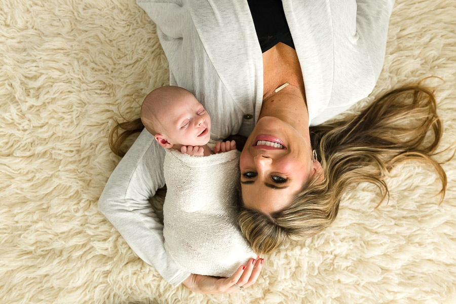 I'm really pleased with all pictures. Family pictures turned out great and that's so nice to have. Especially the close ups of the Henry's face and little hands, the ones of Josh's holding the baby, and me laying on the rug with the baby. Love that you were willing to include the dog because those are some of my favorite pictures. Also, it was great you let my mom jump into just a few. The images of just the nursery are so gorgeous and I would not have expected I would like the pictures without people in them. I worried ahead of time about what I should wear and it really didn't matter because you found ways to take pictures with flattering angles and poses.