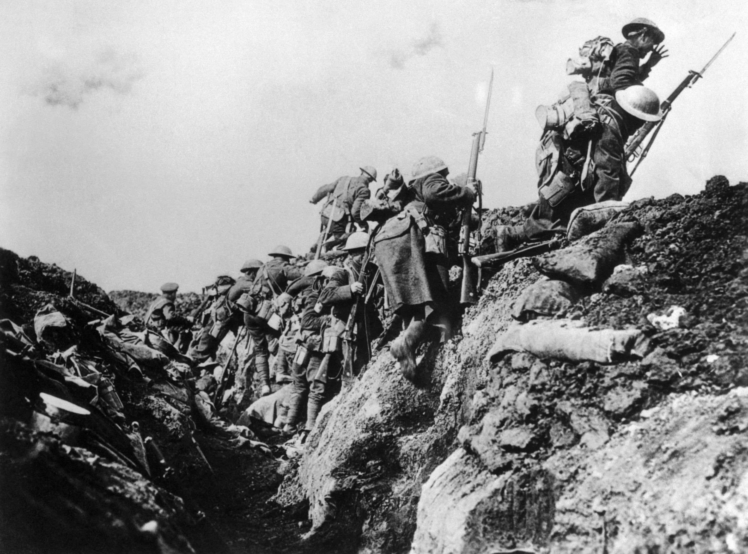 canadian-soldiers-going-over-trench.jpg
