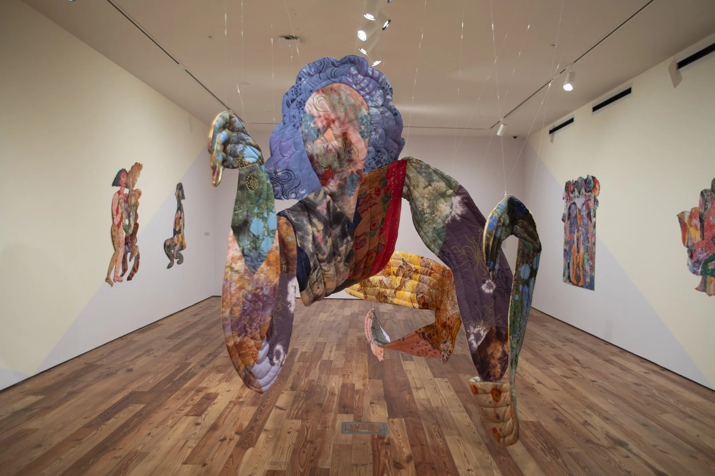   Sombra , 2026. Hand dyed and printed fabric, thread, batting and stuffing. 15 ft long (4.572 M), varies with installation. 