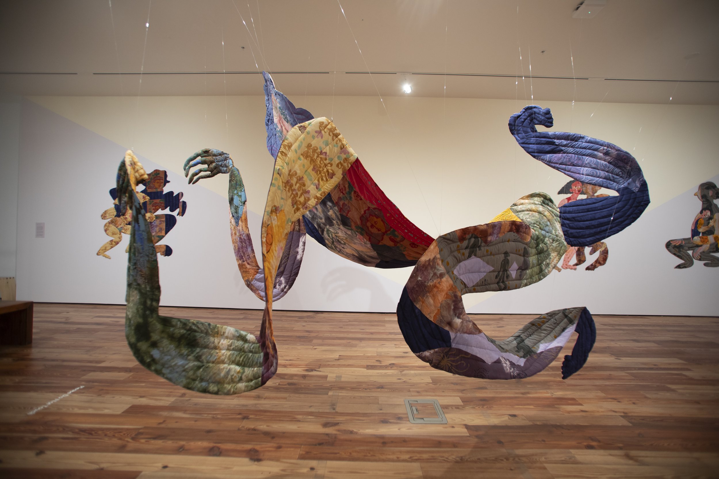   Sombra , 2026. Hand dyed and printed fabric, thread, batting and stuffing. 15 ft long (4.572 M), varies with installation. 