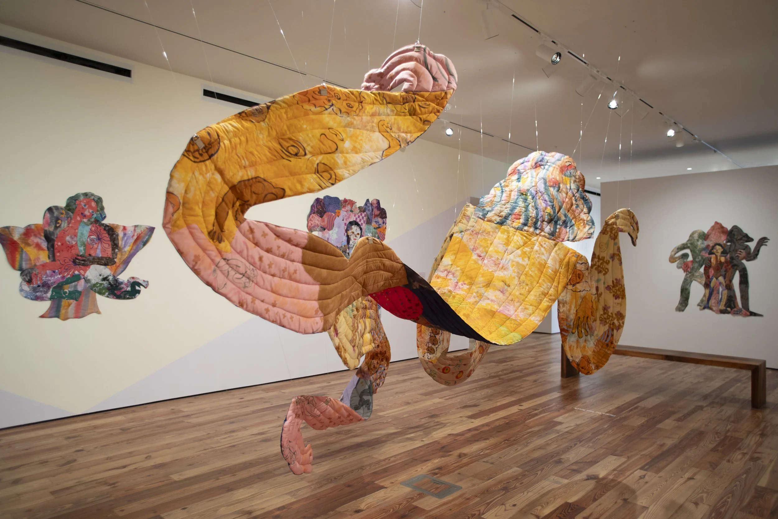   Sombra , 2026. Hand dyed and printed fabric, thread, batting and stuffing. 15 ft long (4.572 M), varies with installation. 