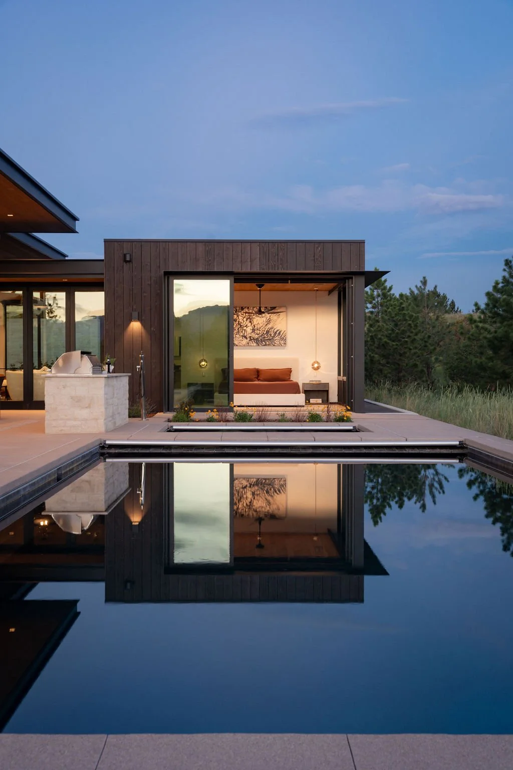 MaggiesFarm_SurroundArch-Exterior-NorthWest-Elevation-Primary-Suite-Twilight.jpg