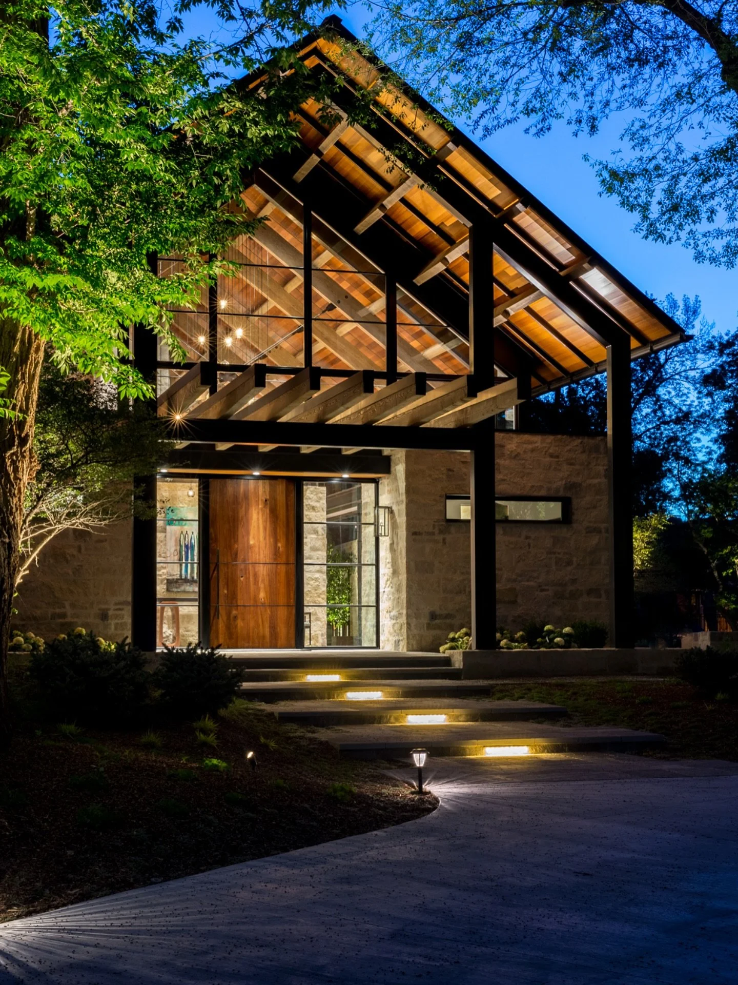 As you proceed toward the entry of Calcaire, the entire armature comes into display through the clerestory glass gable. Delicately tapered timber beams and purlins reach out to greet you, drawing you into the glowing structure beyond. 

Builder: @har