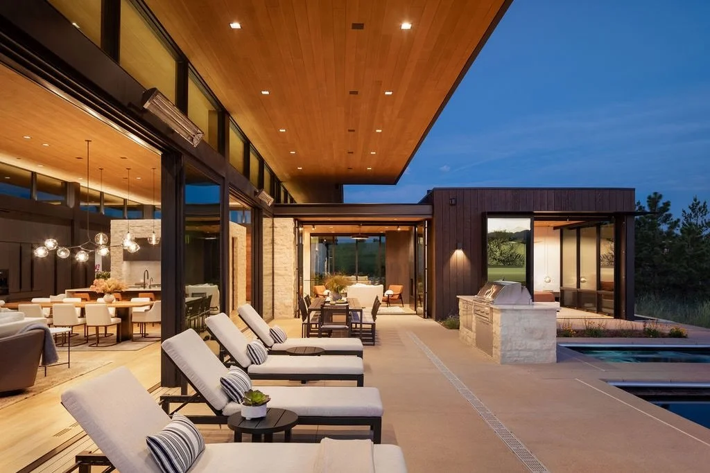 Reaching out in a heroic, 12-foot cantilever, the hemlock ceiling at Maggie&rsquo;s Farm extends over the pool patio. Interconnecting kitchen, living, dining, and the primary suite, it becomes a central space where the line between inside and out dis