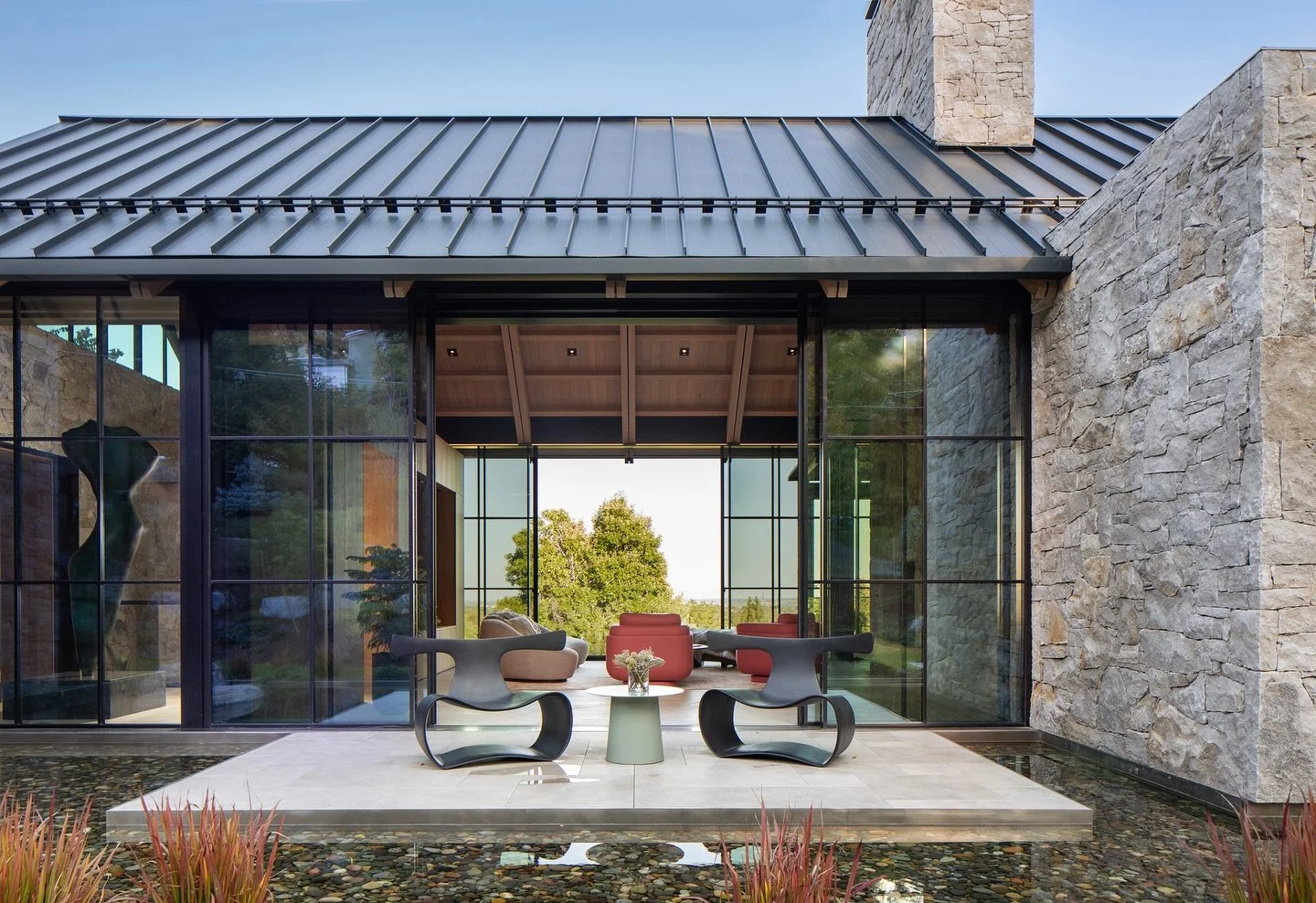 Amani is a distillate of the elemental palette that defines our work: grounding stone, raw steel, and soft, warm woods. As the glass walls retract, the pure form remains, sculpted from this material trinity. 

Architecture + Interiors: @surroundarch 