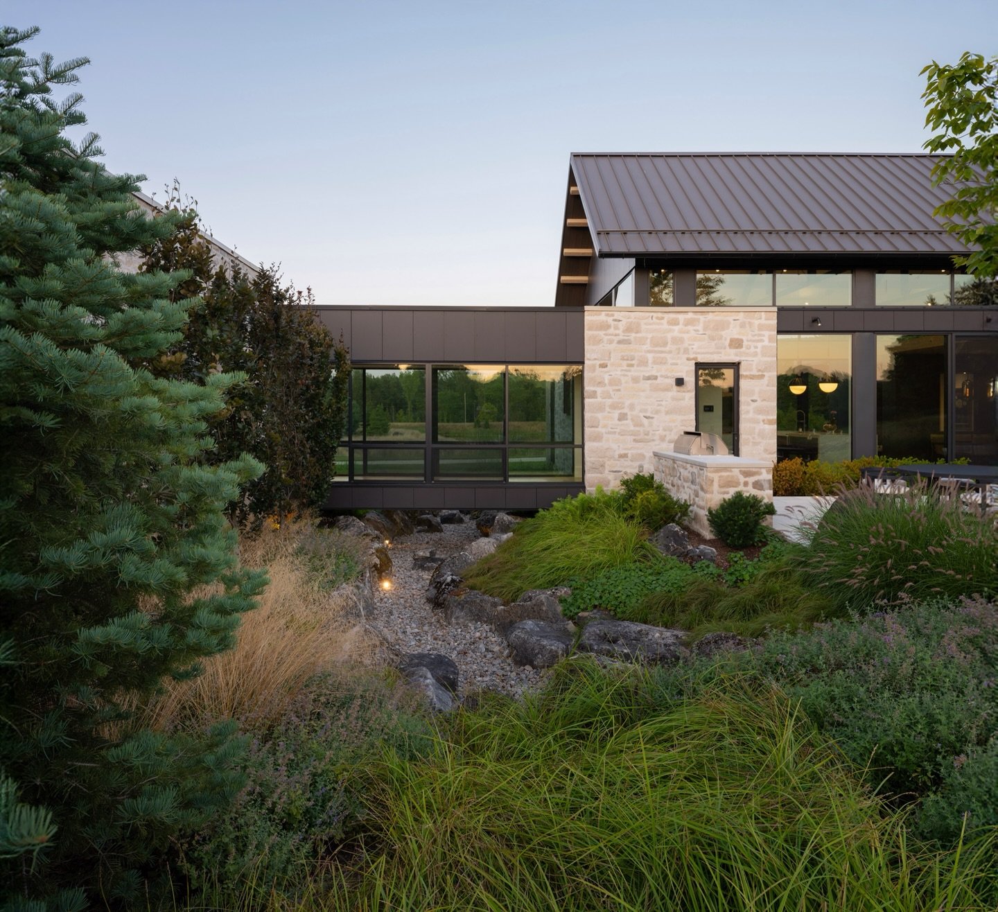 Our process begins and ends with how the home engages the site. Spanning over this seasonal dry creek curated by @thelandmarkgroup , you&rsquo;re immersed in the sights and sounds of the landscape, celebrating the relationship between site and struct