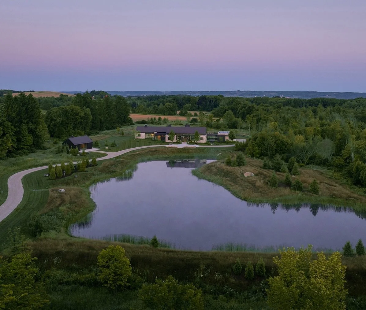 Our process begins and ends with how the home engages the site. While traveling through the vast farmland north of Toronto on our first visit to this rural site, a realization occurs that the approach becomes perched atop a plateau overlooking an anc