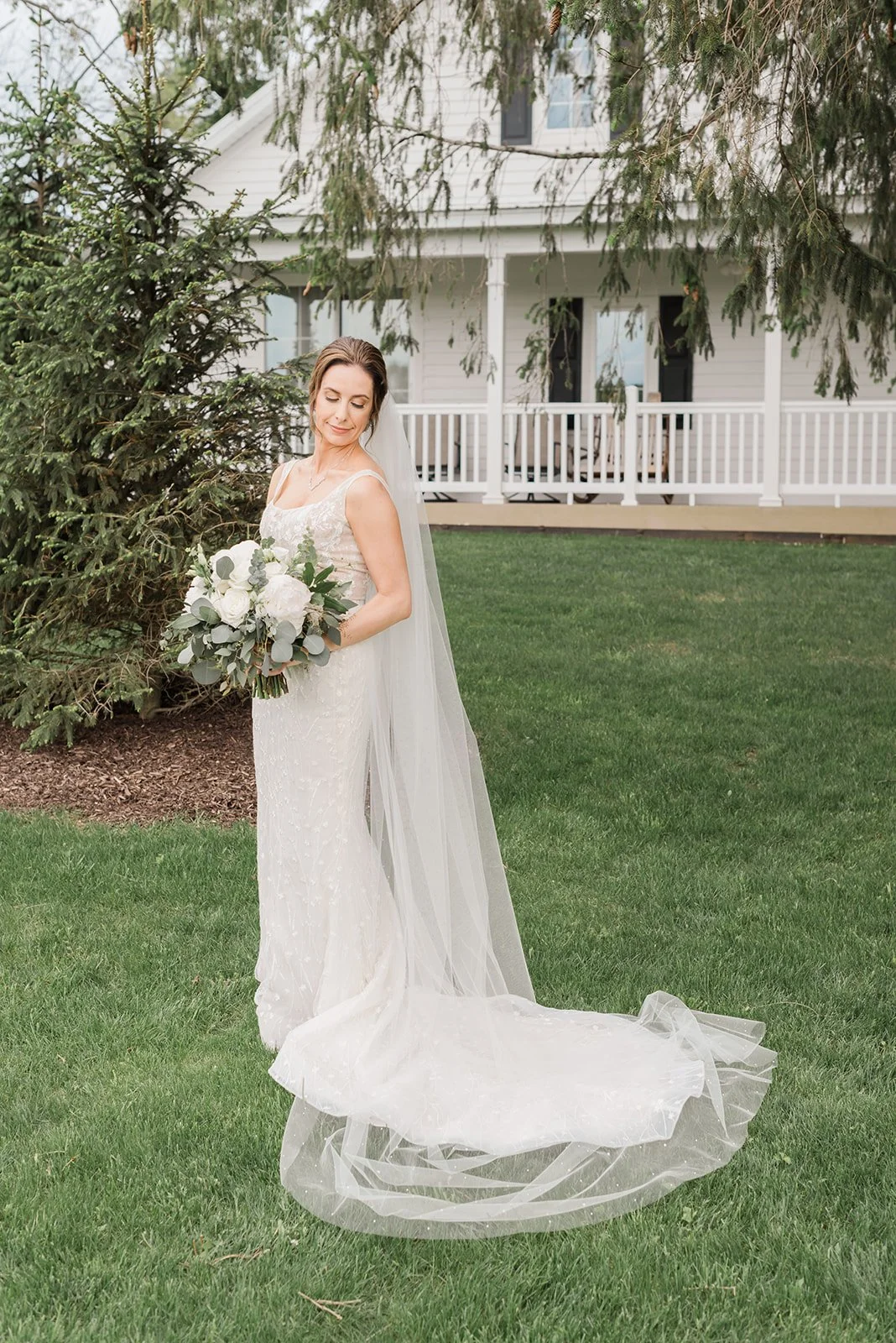 Lauren and Mike's wedding at Lilac Acres - bride posing with bouquet