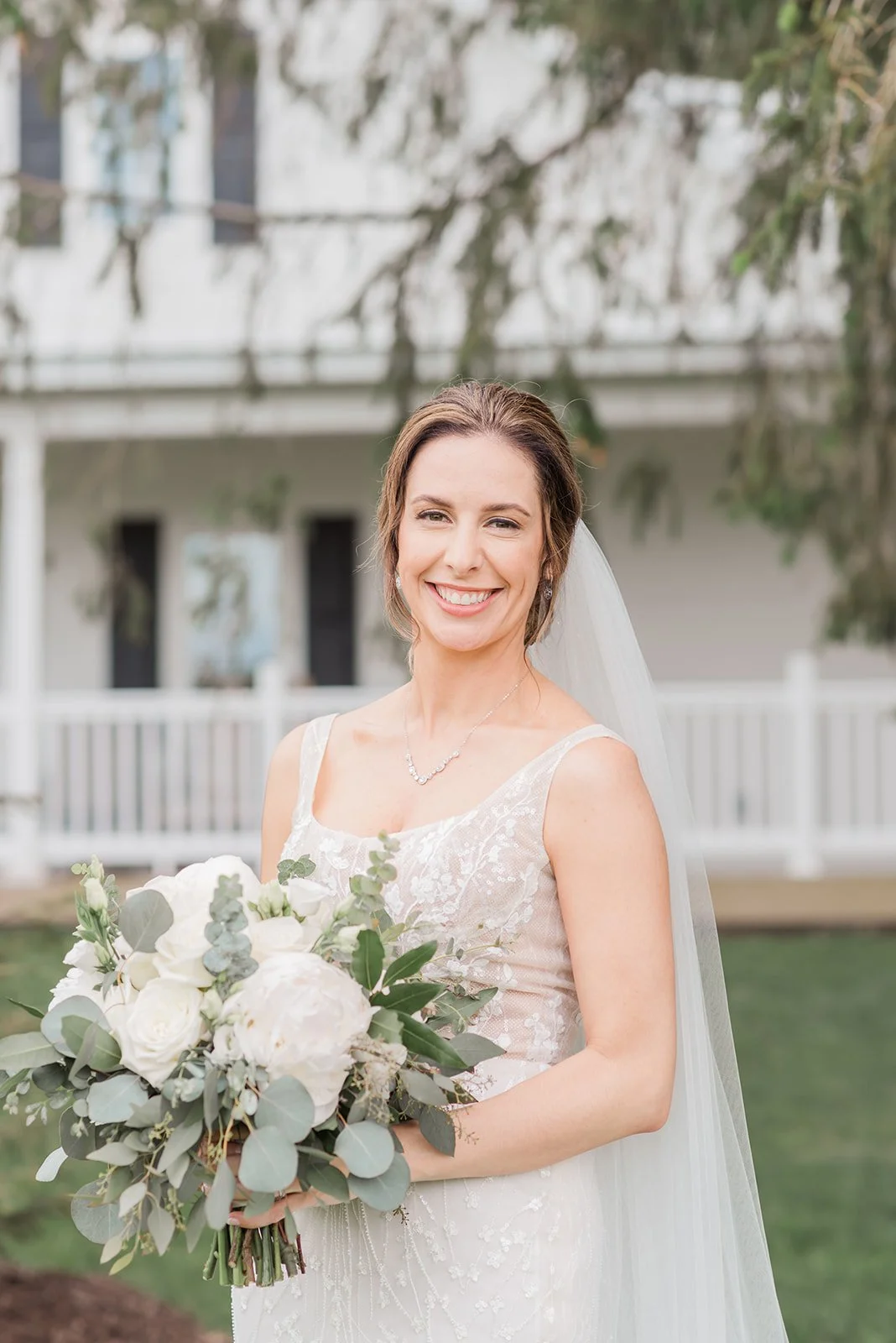 Lauren and Mike's wedding at Lilac Acres - bride posing with bouquet