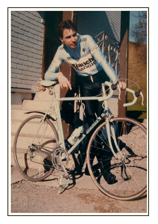 Training in February 1987. Mudguards to scratch the new frame, and Zurich bicycle number plate attached by a plastic frame clip. The all polyester sublimated kit was mostly Descente including the full "thermo suit" needed to ride in those temperatures. I had about five of these thermo suits and over the years they began to look like they'd "melted" and had to be thrown away. The rest of our kit was Santini, all that good old wool stuff, even some old woolen dress shirts that looked like they came from Coppi's era. Photo by Willi Felix