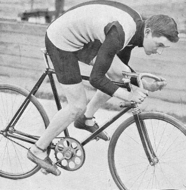 Thaddäus Robl posing for the camera on a track bike with stock forks but way over the front in a stayer's position.