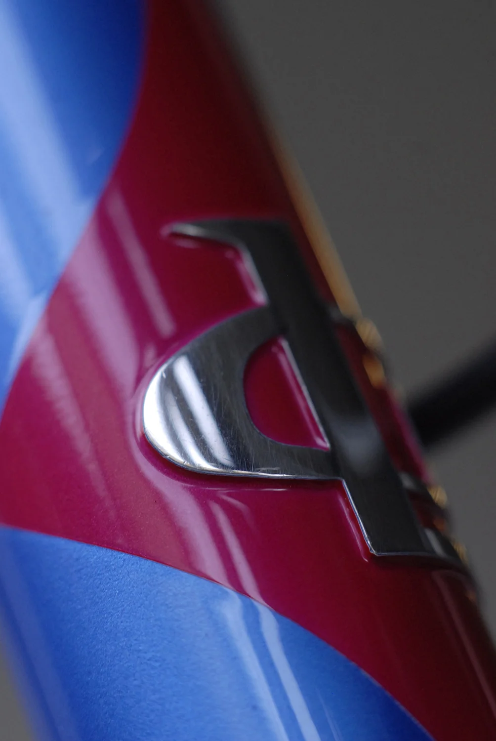 Hand polished stainless steel Lllewellyn bike head badge